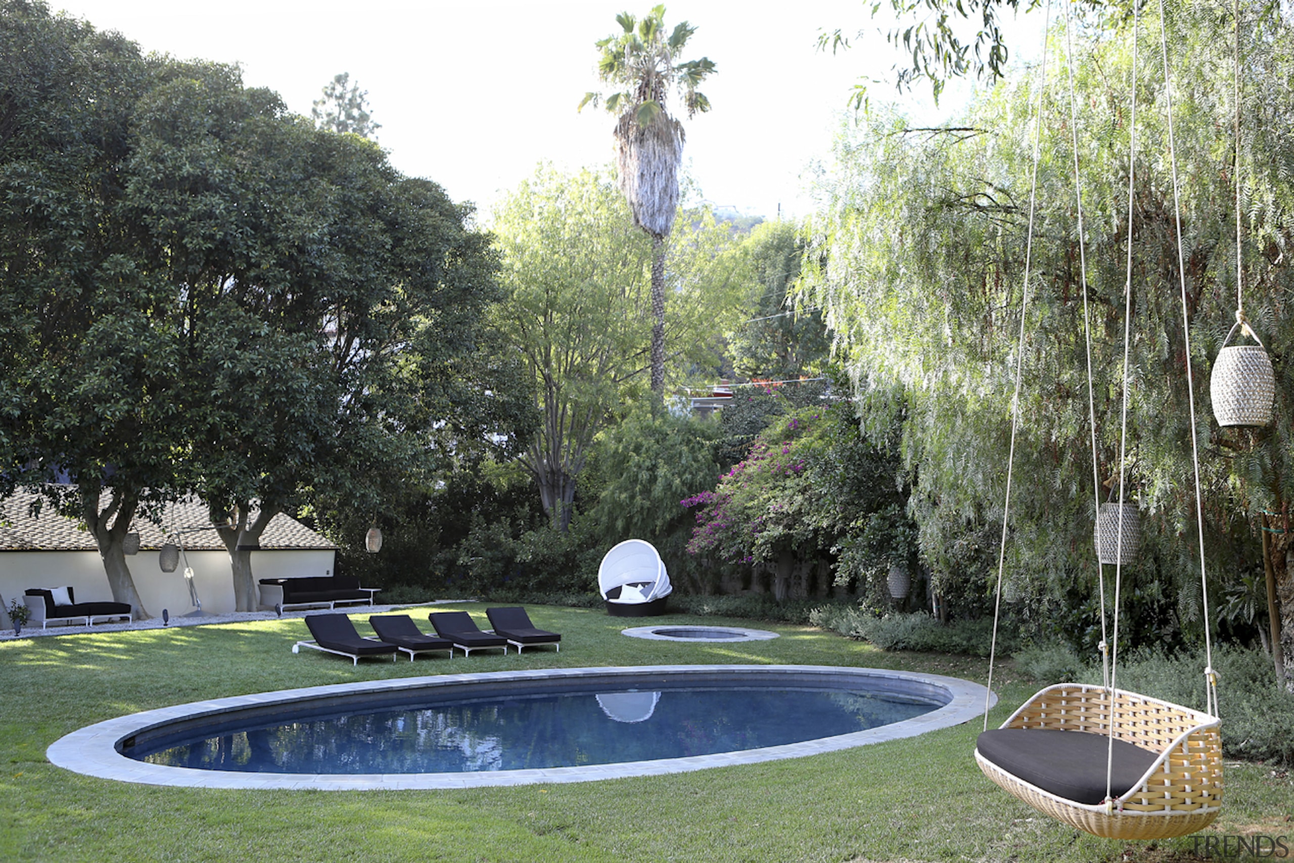 The Castle's elegant oval pool. - To the 