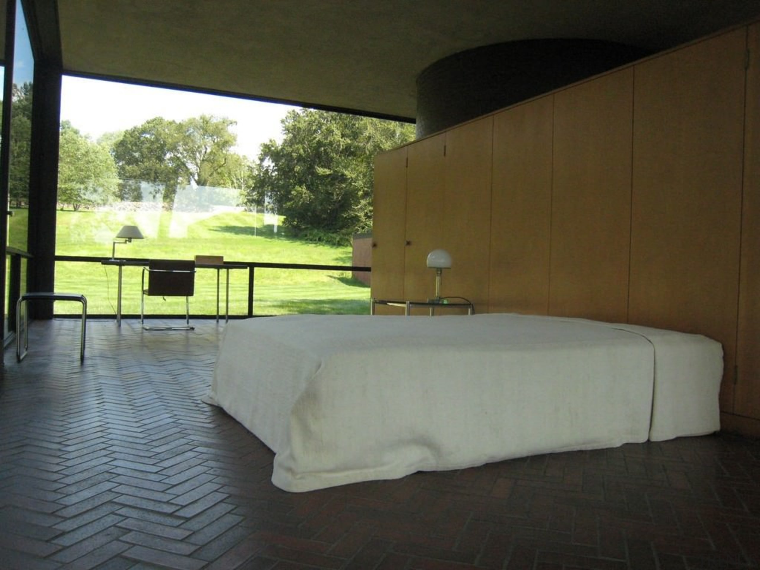 The Glass House by Philip Johnson - The architecture, floor, flooring, furniture, house, interior design, property, real estate, table, wall, brown, gray