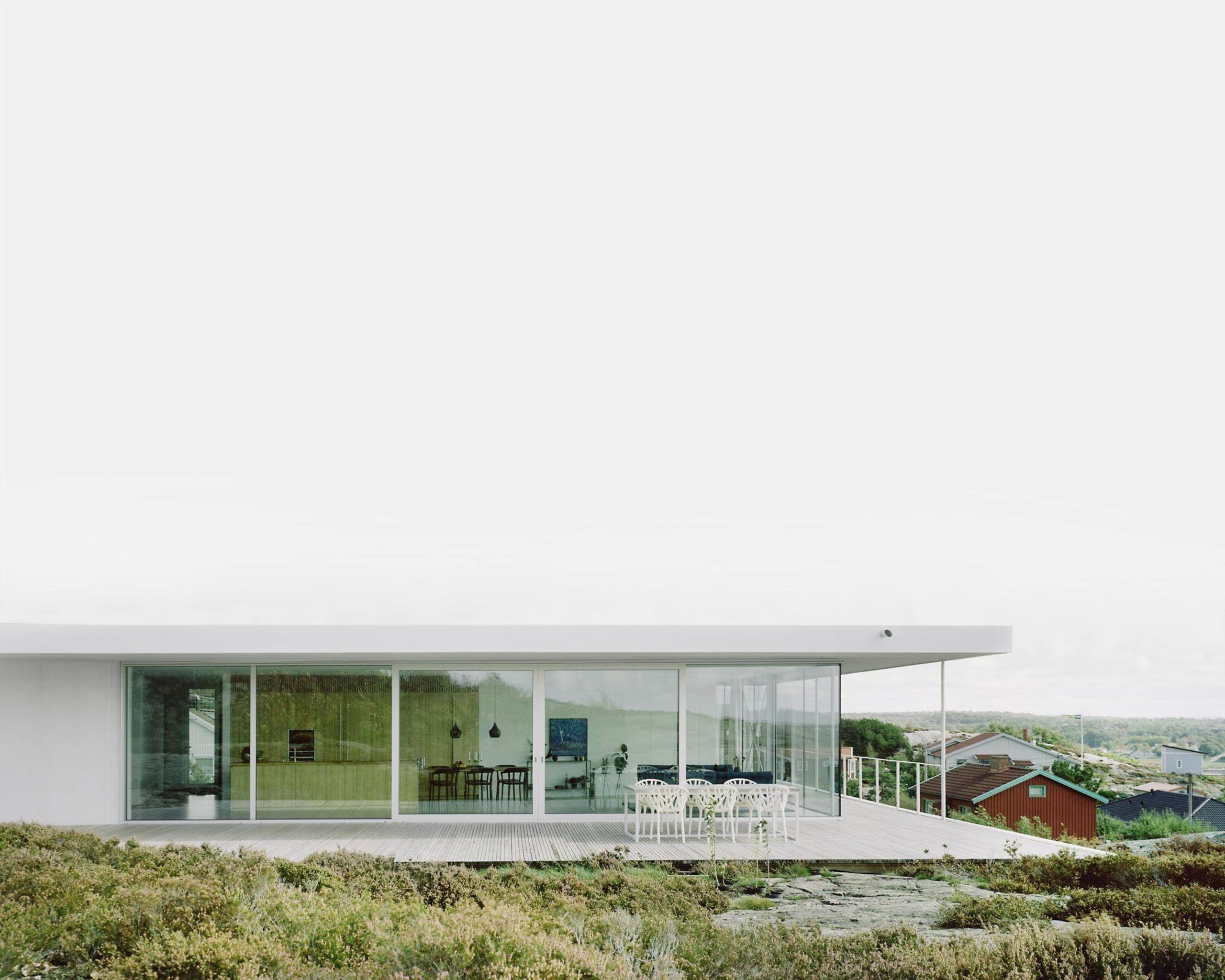 From this angle, you're unable to see the architecture, elevation, facade, home, house, property, real estate, white