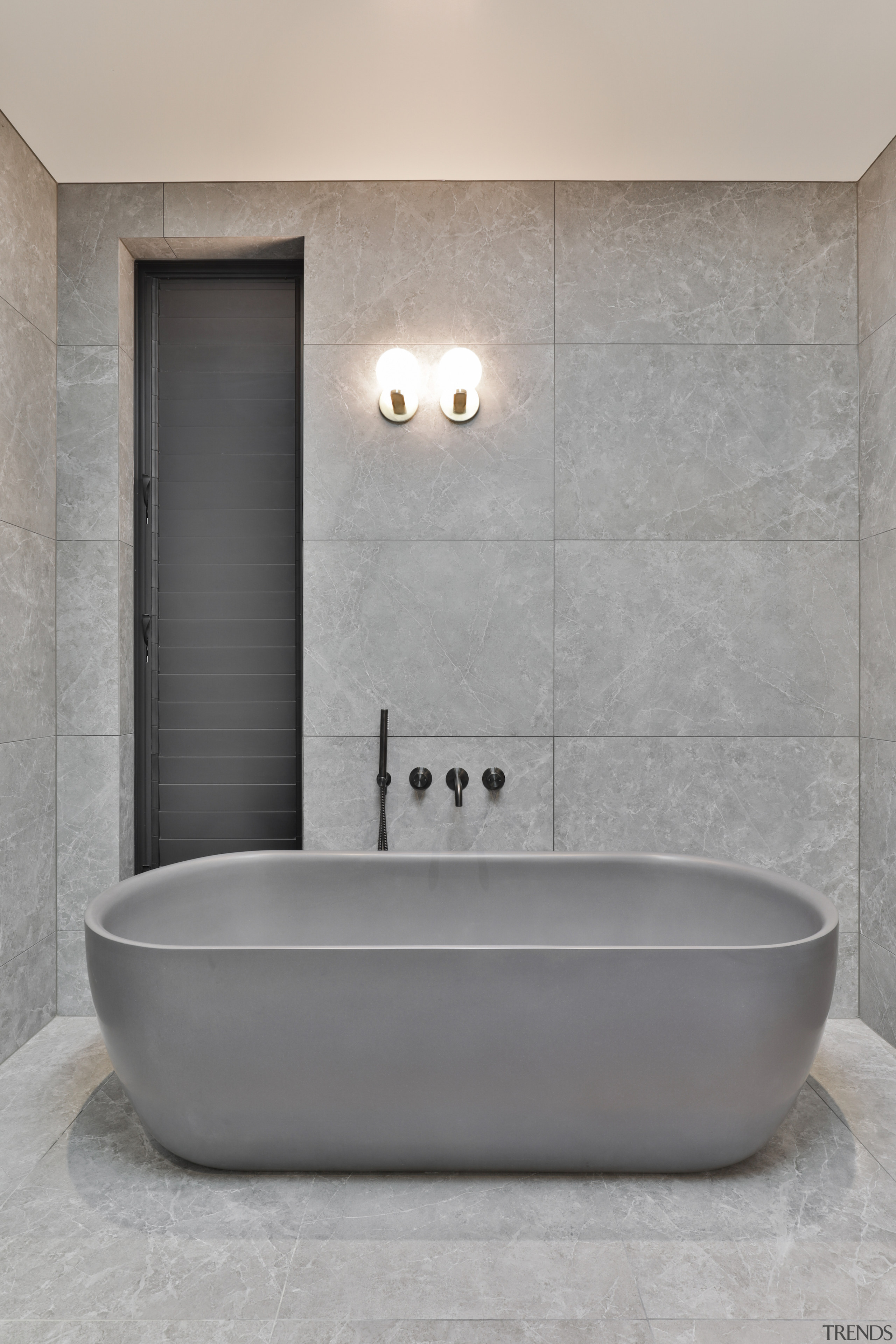 The large format porcelain tiles minimise the need 