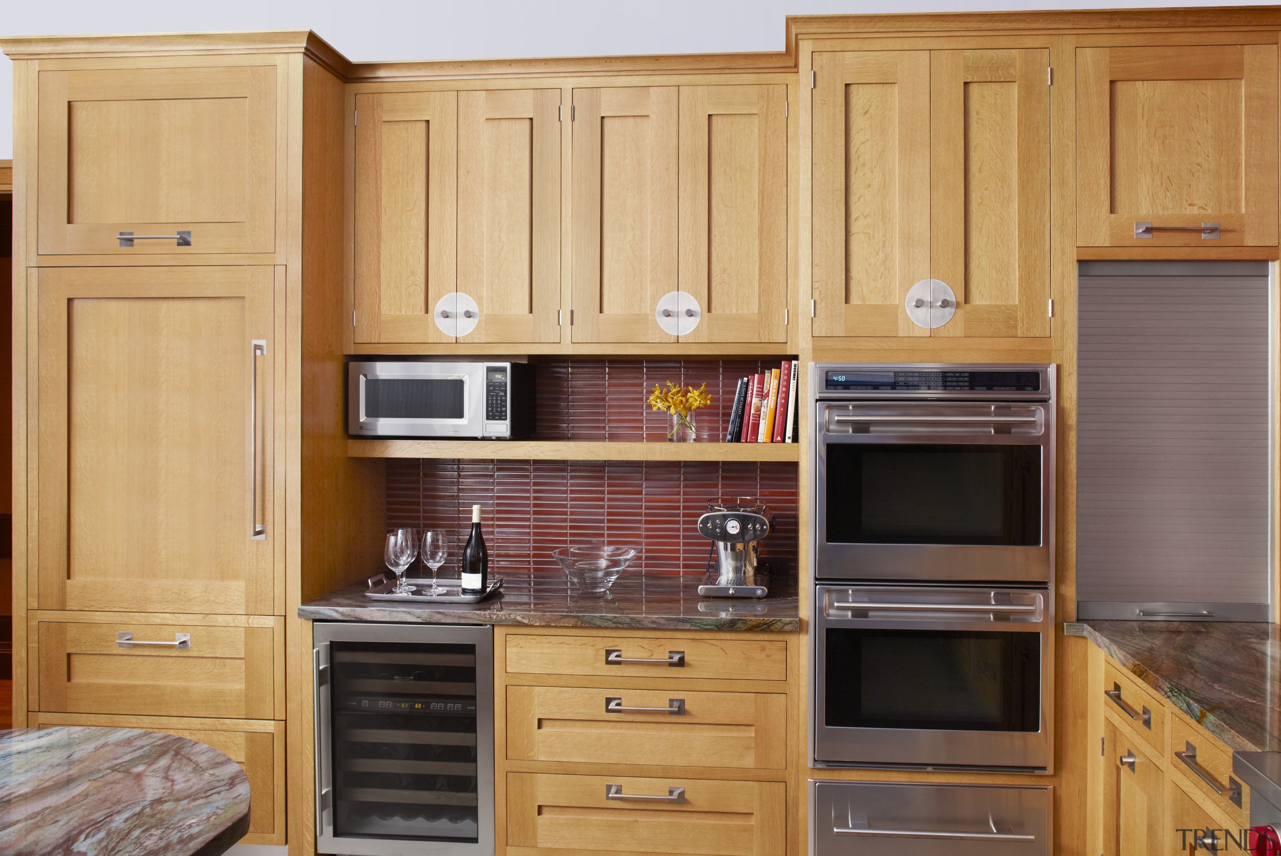 This kitchen was designed by Robert Schwartz of cabinetry, countertop, cuisine classique, cupboard, flooring, furniture, hardwood, home appliance, kitchen, room, wood, wood stain, orange