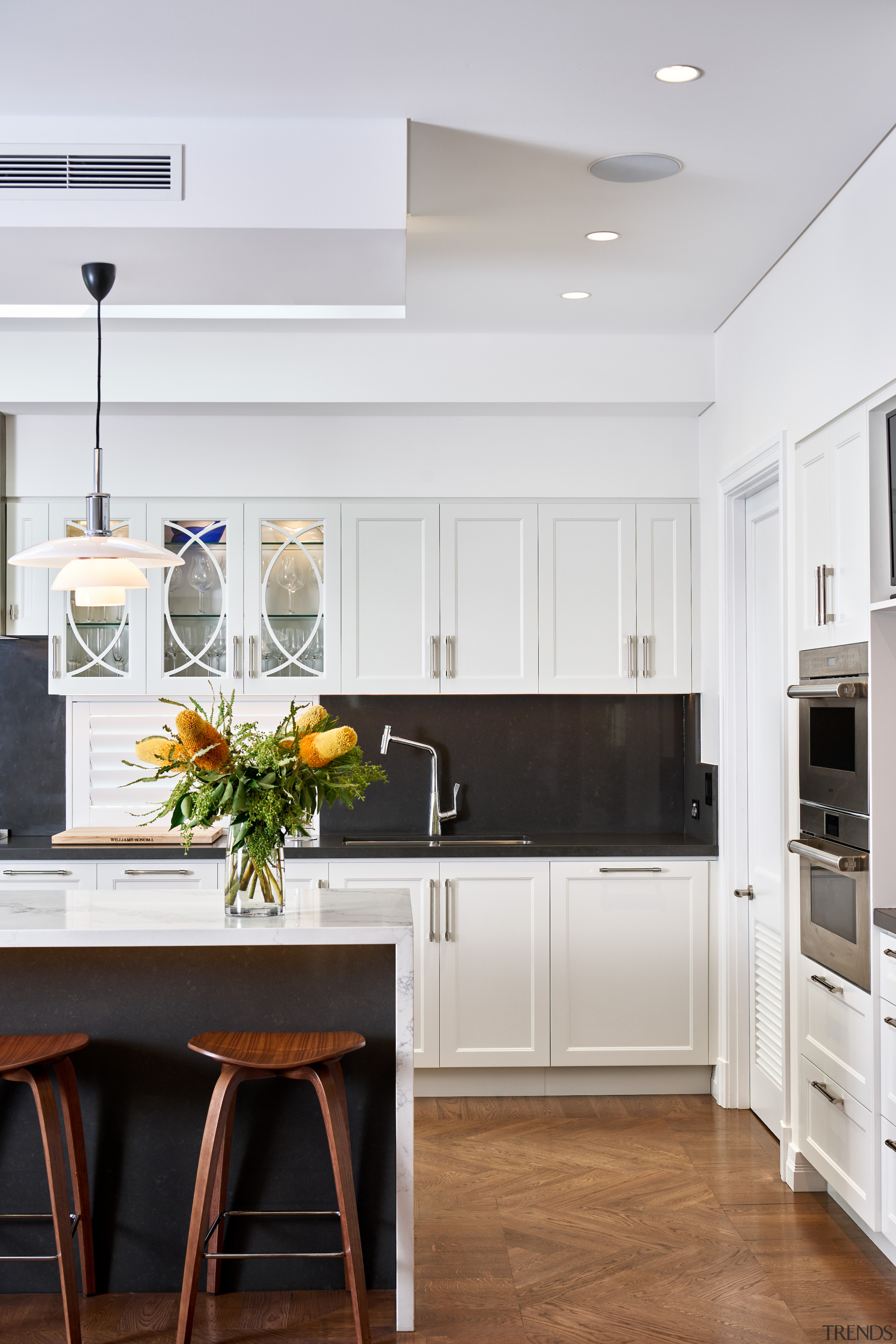 Panelled cabinet doors and a waterfall end island 