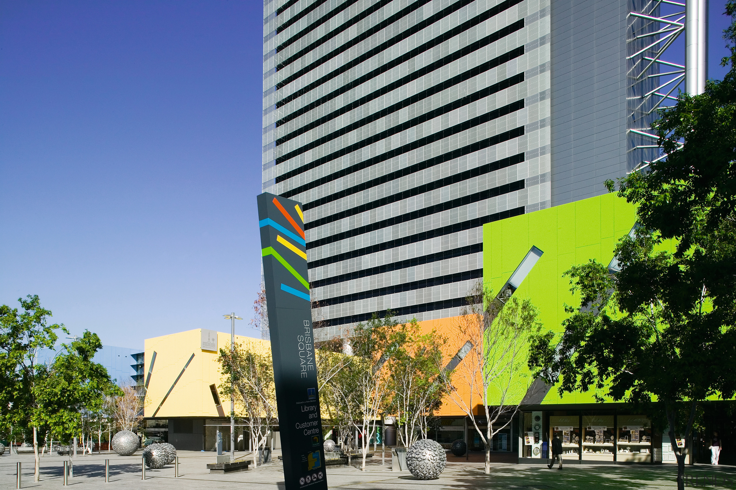 A view of the external Brisbane square sign architecture, building, city, commercial building, condominium, corporate headquarters, daytime, facade, headquarters, metropolitan area, mixed use, real estate, sky, skyscraper, tower block, tree, gray