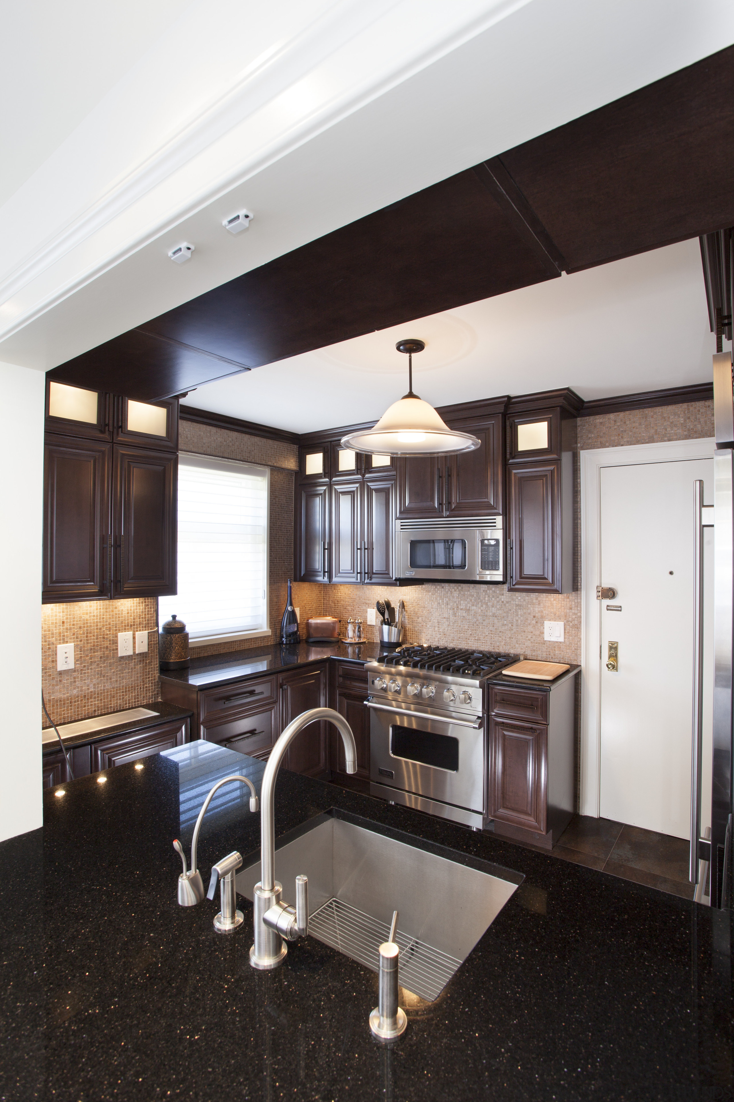 To open up this small kitchen to the cabinetry, countertop, cuisine classique, home, interior design, kitchen, living room, real estate, room, white, black