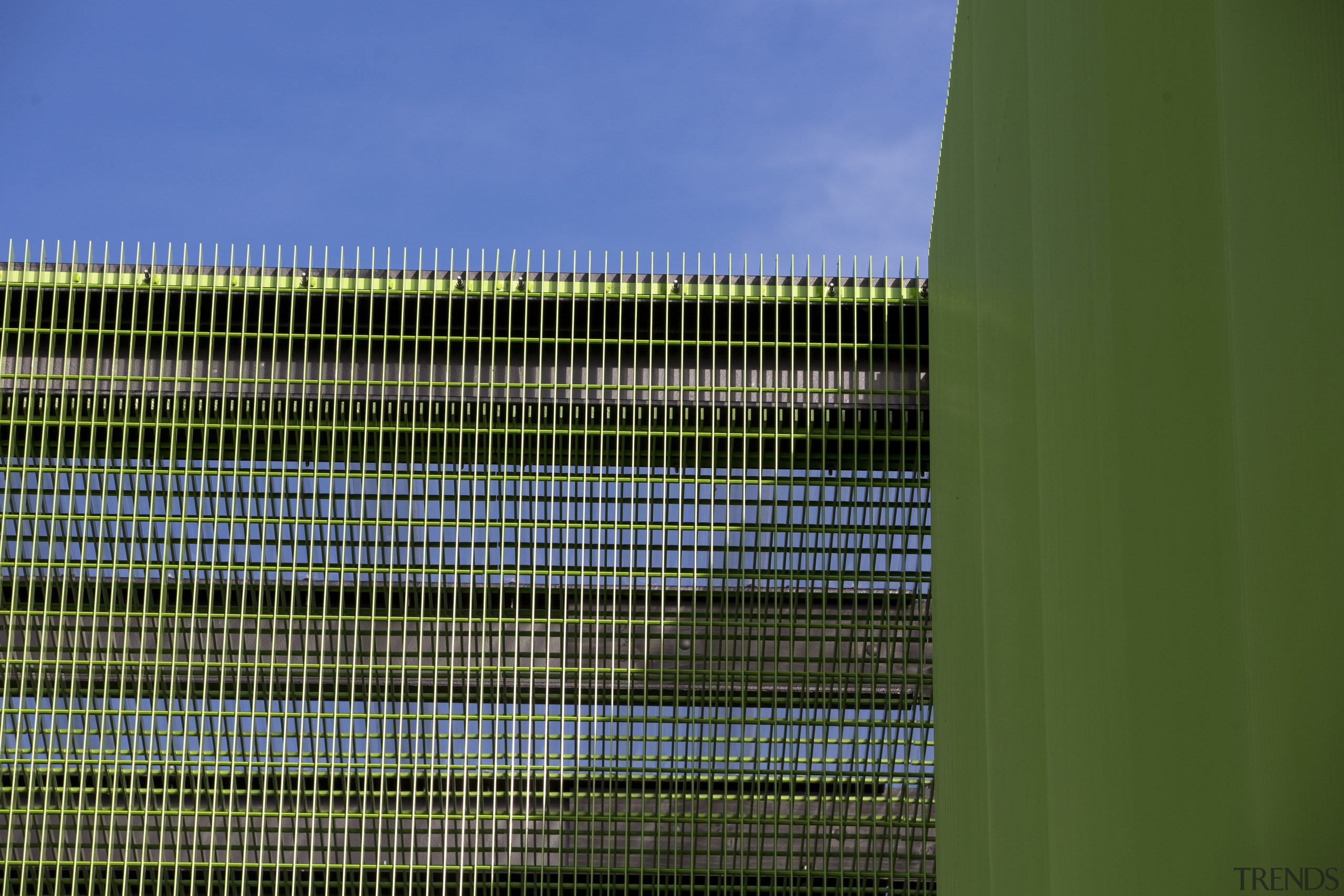 Contrasting cladding  green mesh provides an eye-catching architecture, building, daylighting, facade, grass, green, line, sky, structure, urban area, green, blue