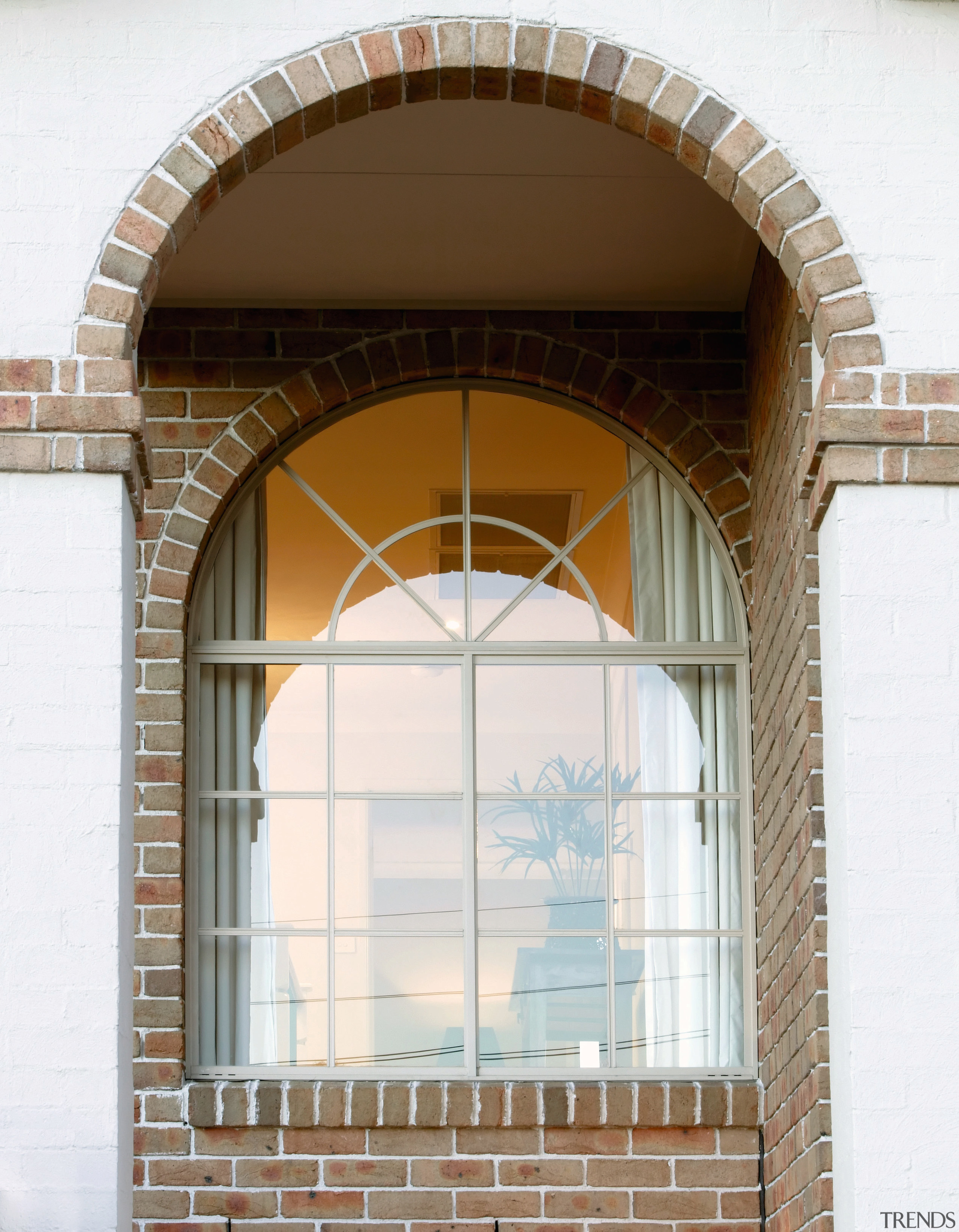 A view of a home designed by Domaine arch, architecture, brickwork, daylighting, facade, structure, window, white, brown