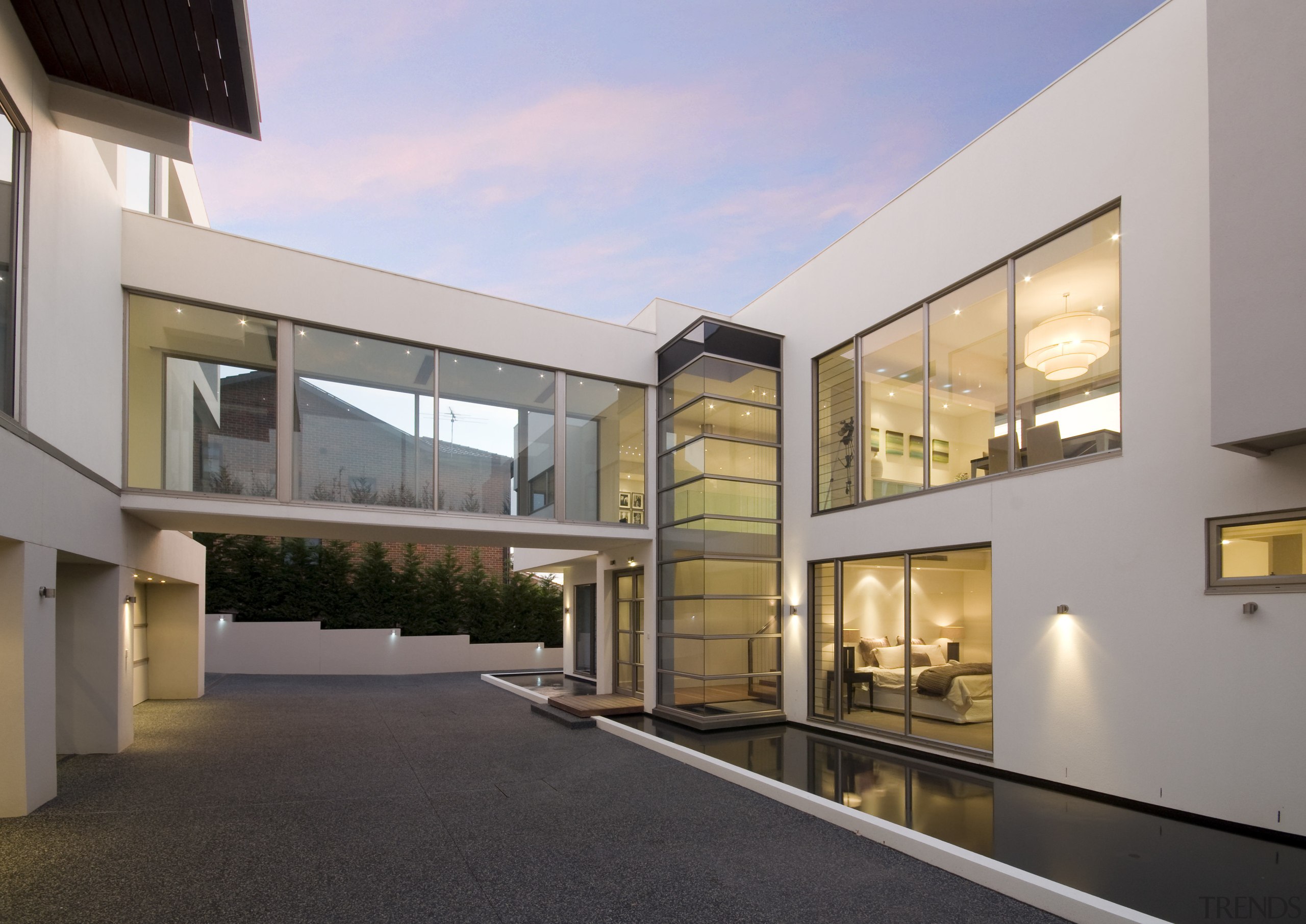 Exterior view of house designed by Graham Jones apartment, architecture, building, condominium, estate, facade, home, house, mixed use, property, real estate, residential area, window, gray