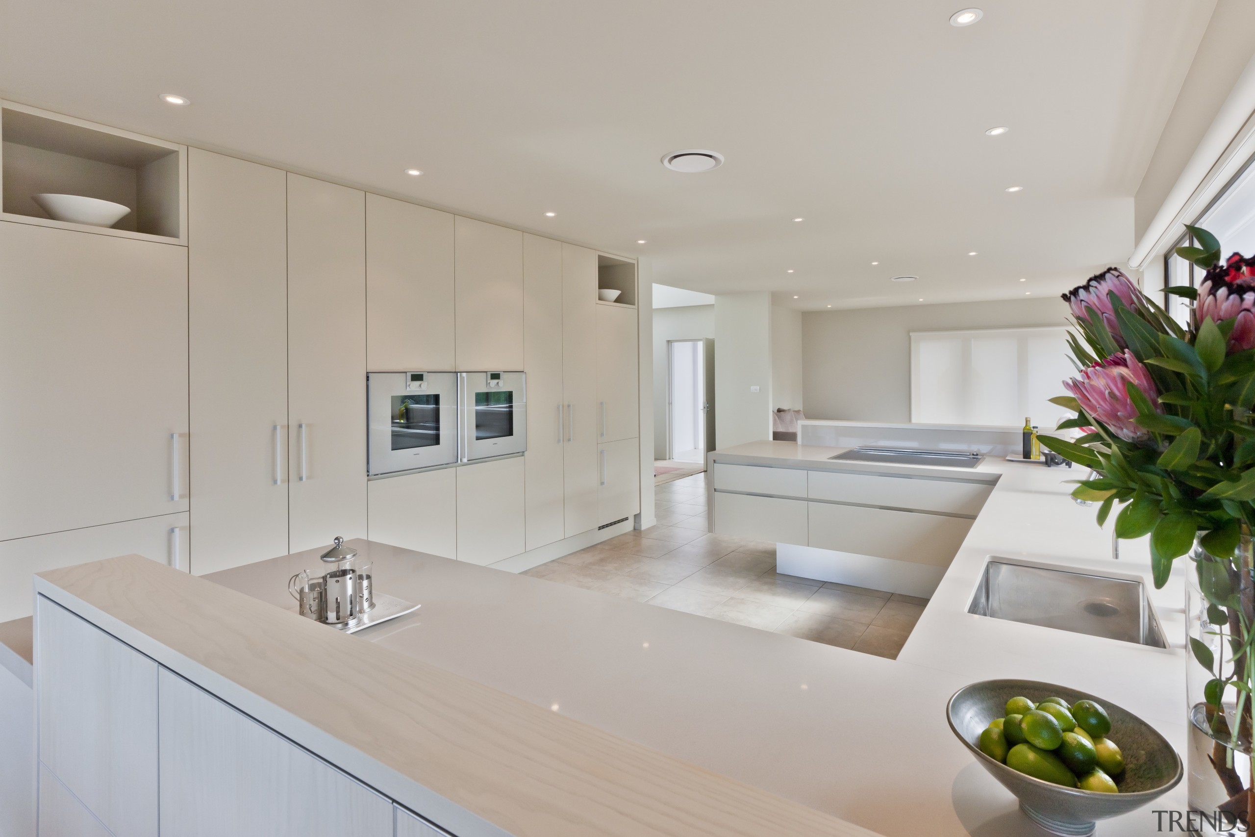 View of light coloured contemporary kitchen with vase countertop, interior design, kitchen, property, real estate, room, gray