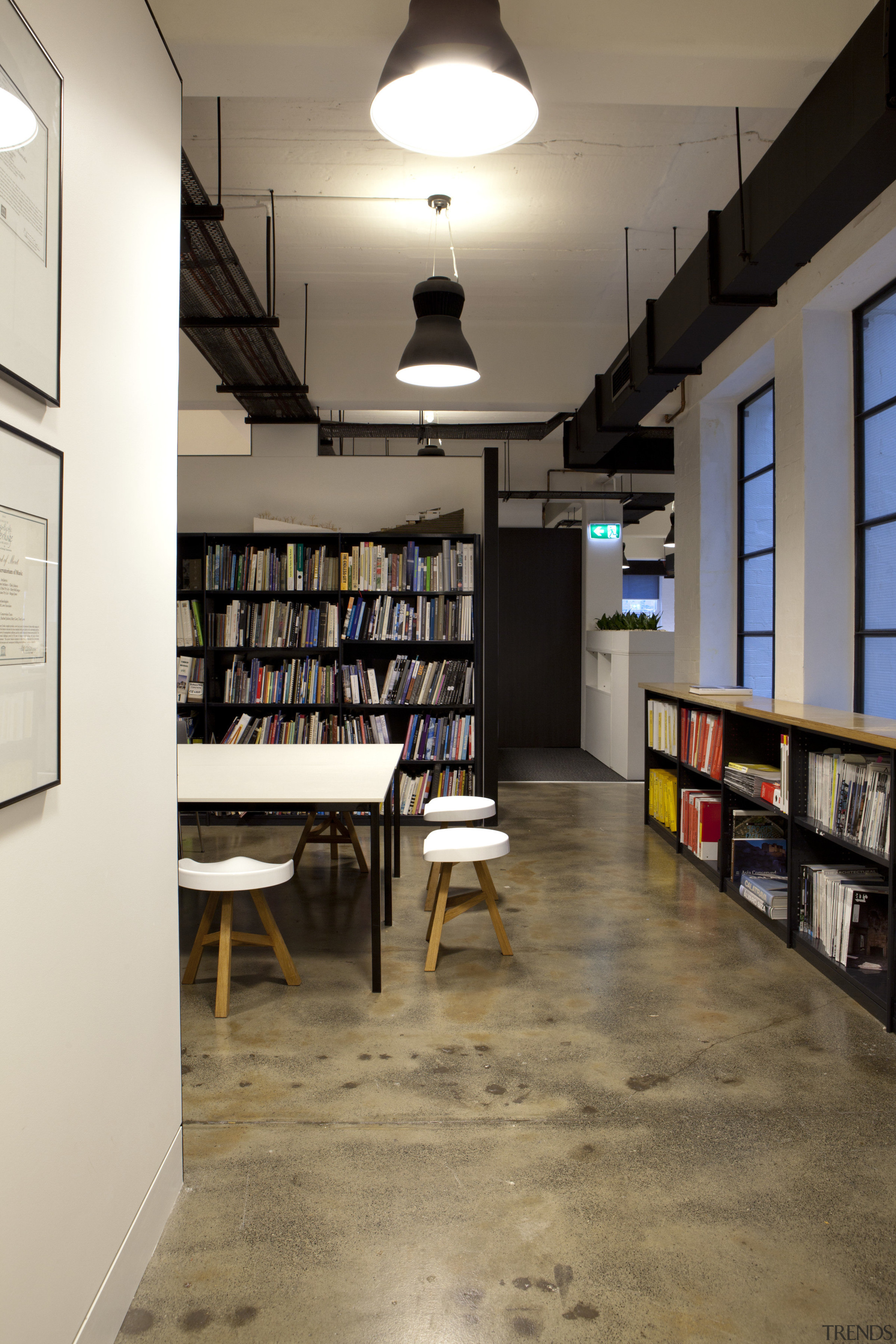 Screen walls in TKDs fit-out of its own bookcase, floor, furniture, institution, interior design, library, public library, shelving, brown, white