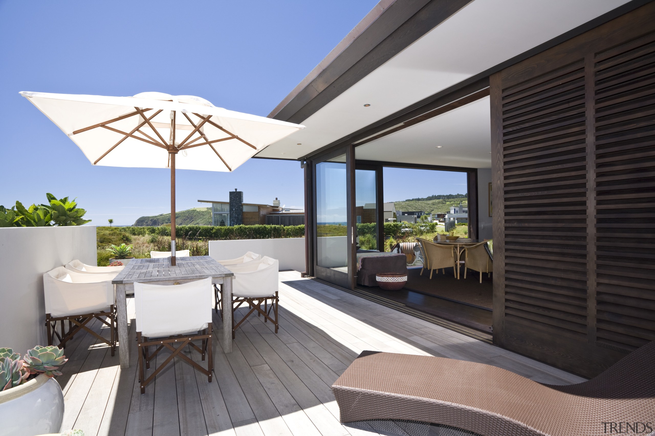 Exterior view of the side of the bach apartment, estate, home, house, interior design, penthouse apartment, property, real estate, resort, roof, shade, window, black, gray