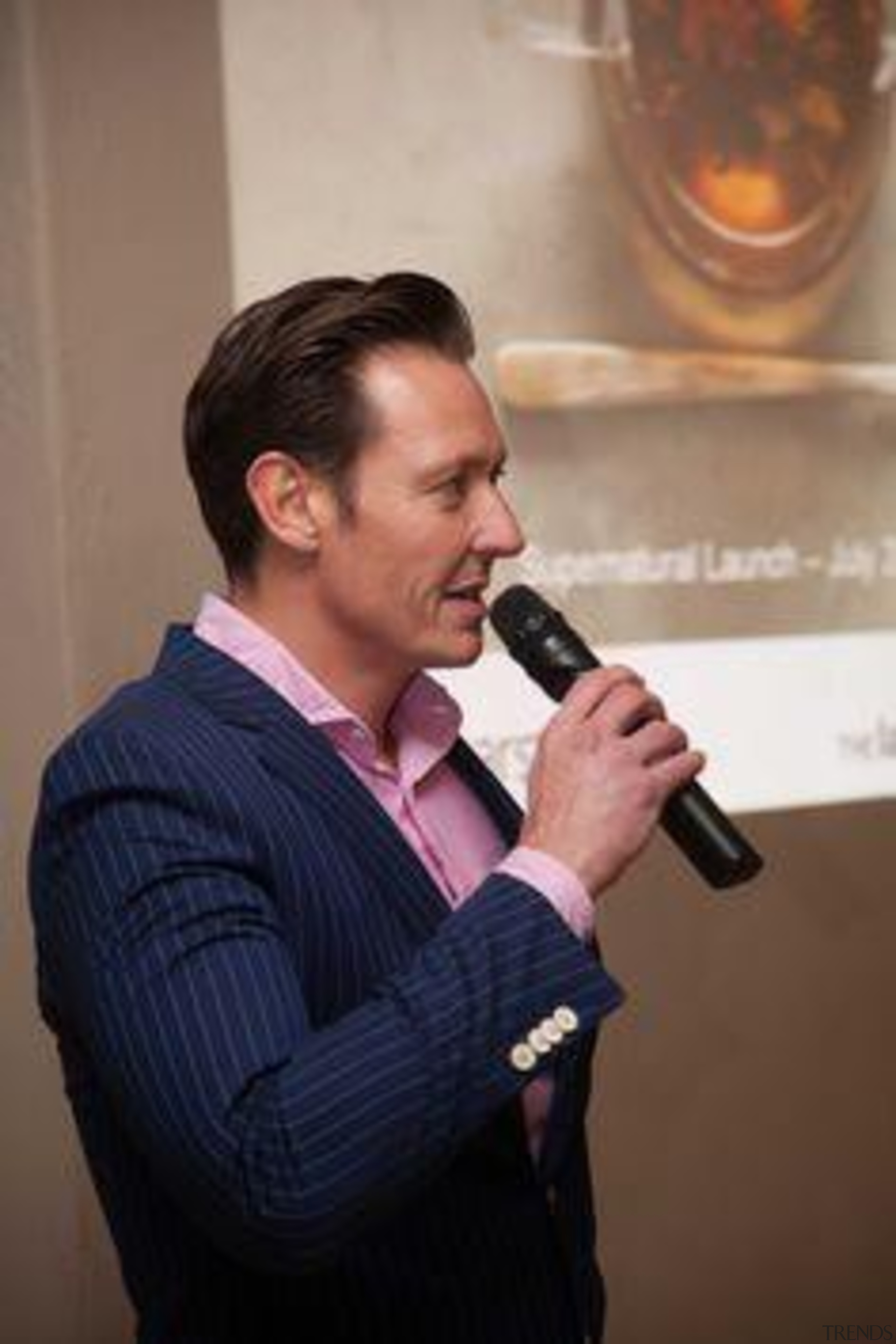 Melle de Pater (Laminex New Zealand) — at chin, microphone, public speaking, singer, singing, brown