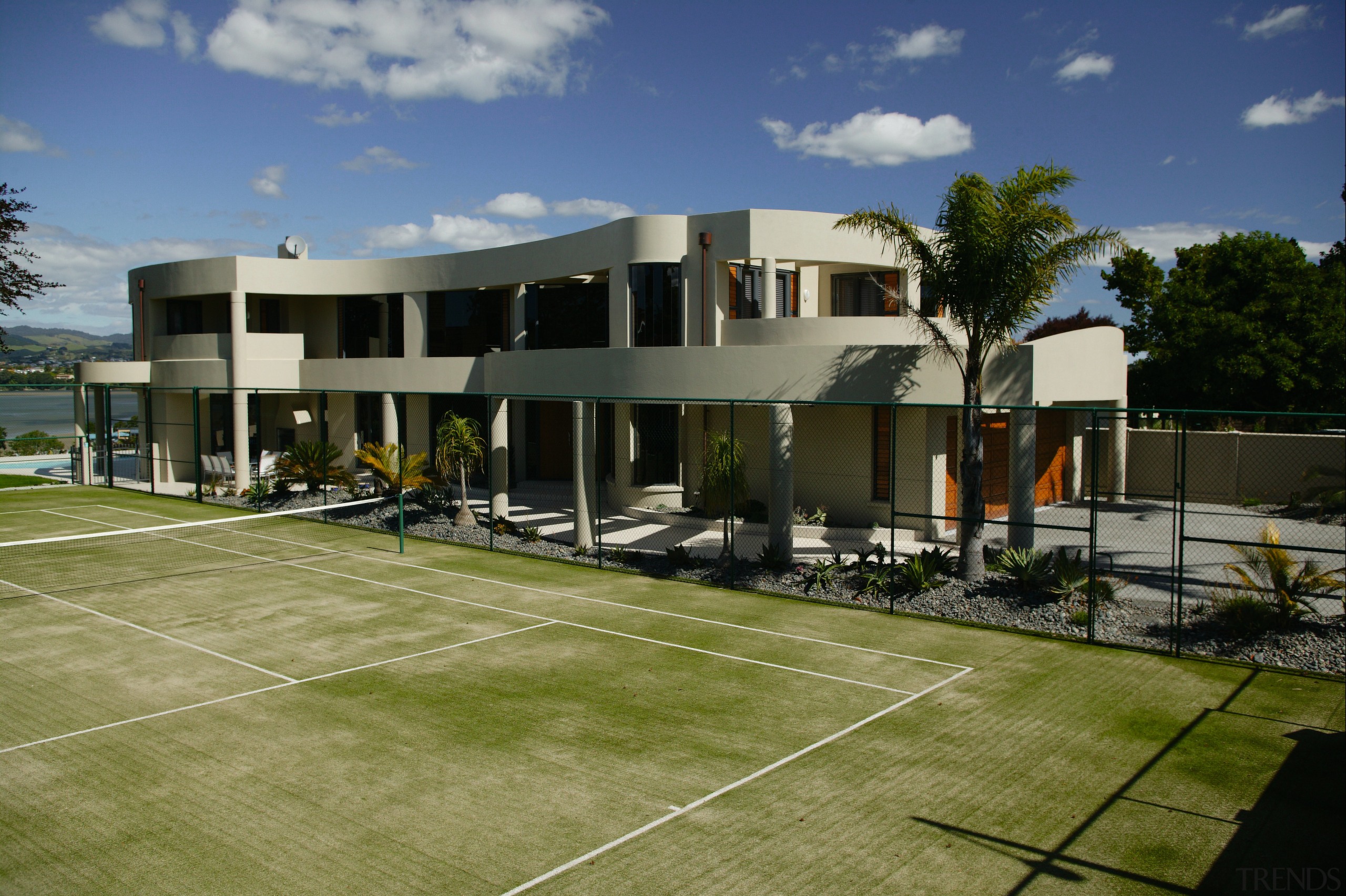 A house with a tennis court &amp; landscaping architecture, estate, facade, home, house, property, real estate, residential area, brown