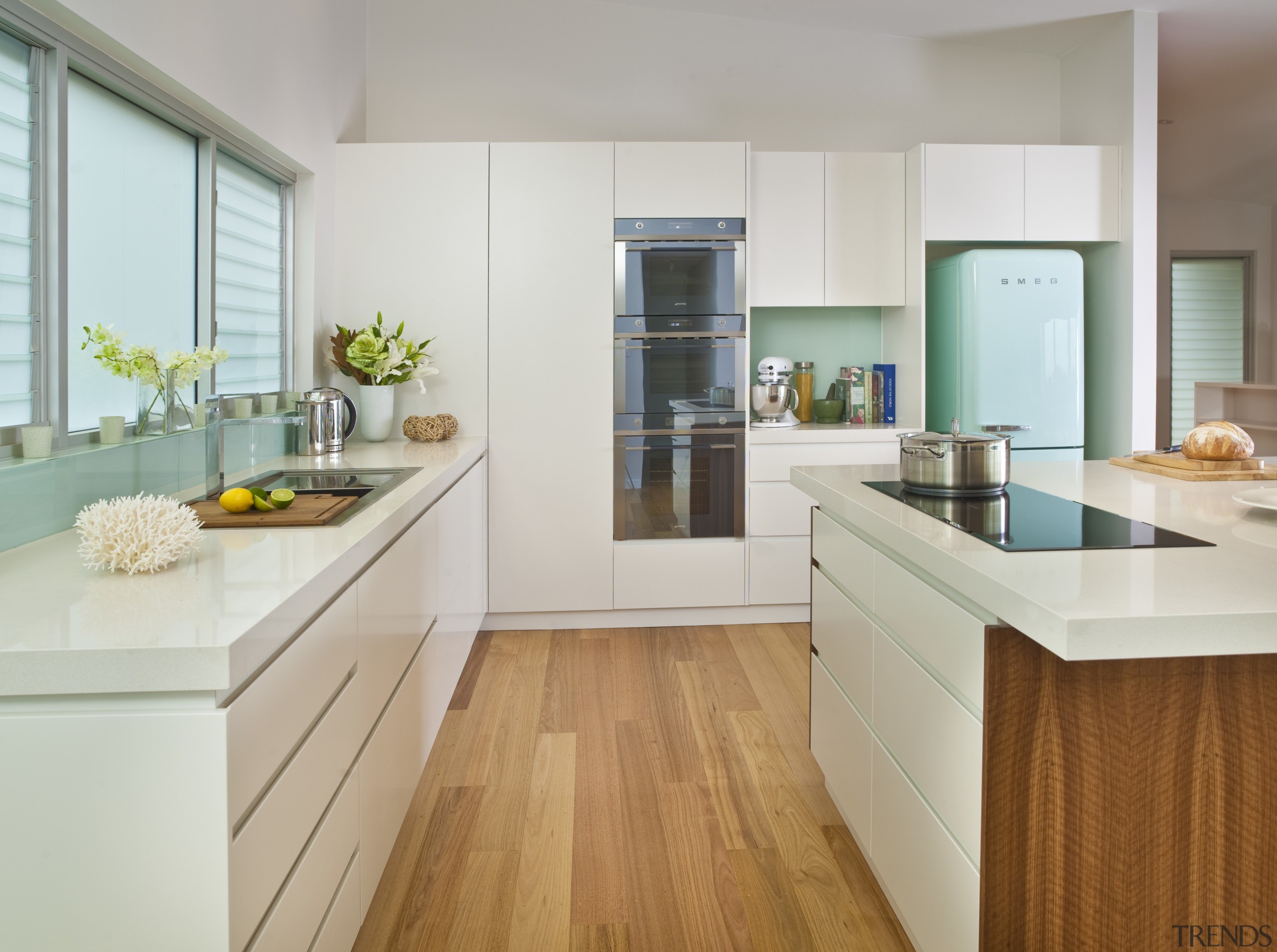 View of contemporary light toned kichen with wooden cabinetry, countertop, cuisine classique, floor, hardwood, interior design, kitchen, real estate, room, gray