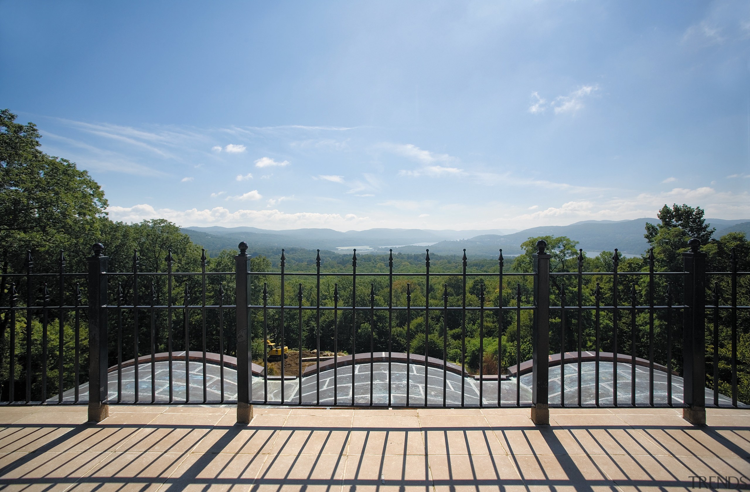 Exterior view of the landscaped gardens and pavings, area, estate, fence, house, land lot, landscape, outdoor structure, property, real estate, residential area, sky, structure, tree, teal