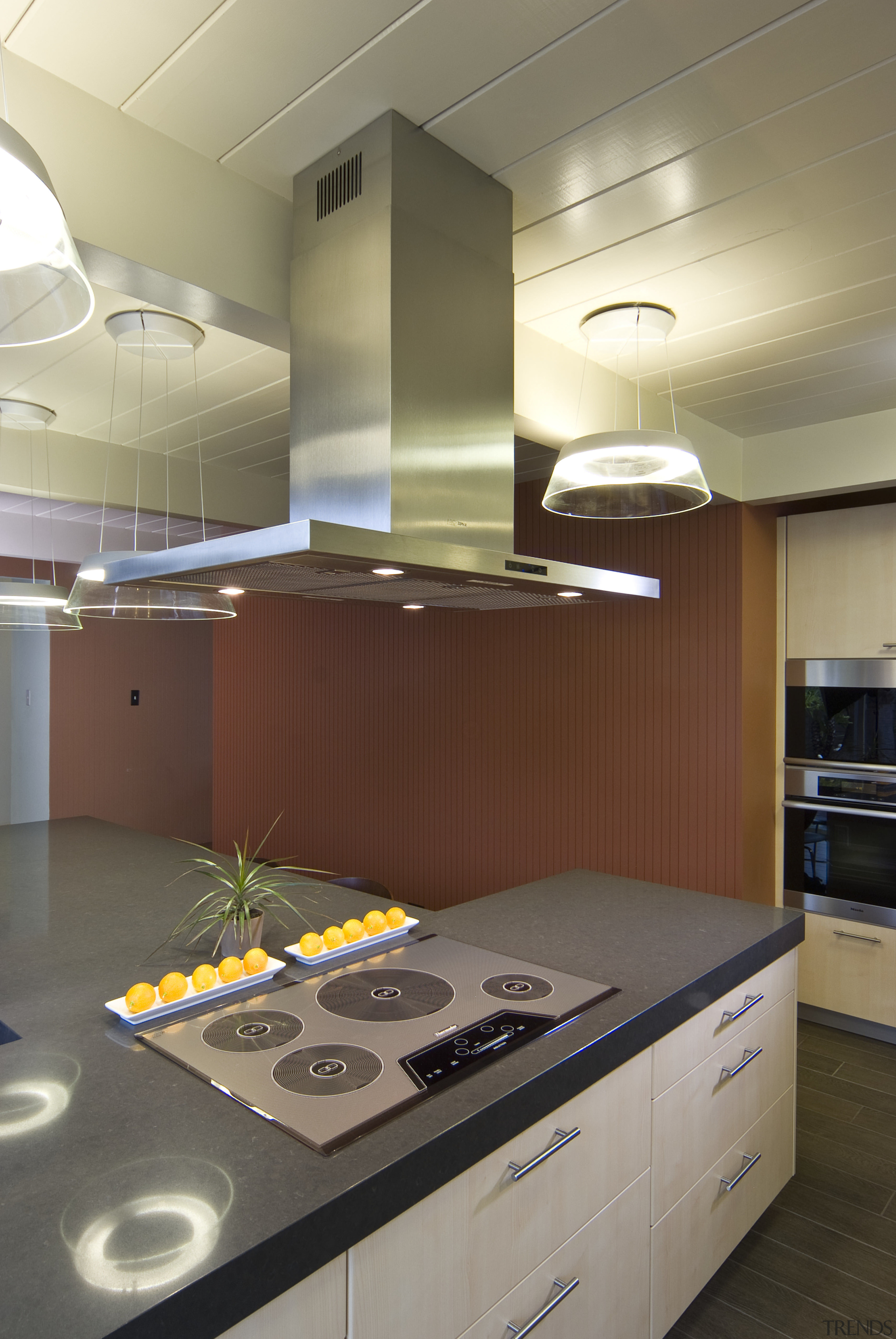 View of dark benchtop, range hood and cooktop cabinetry, ceiling, countertop, interior design, kitchen, room, brown, gray