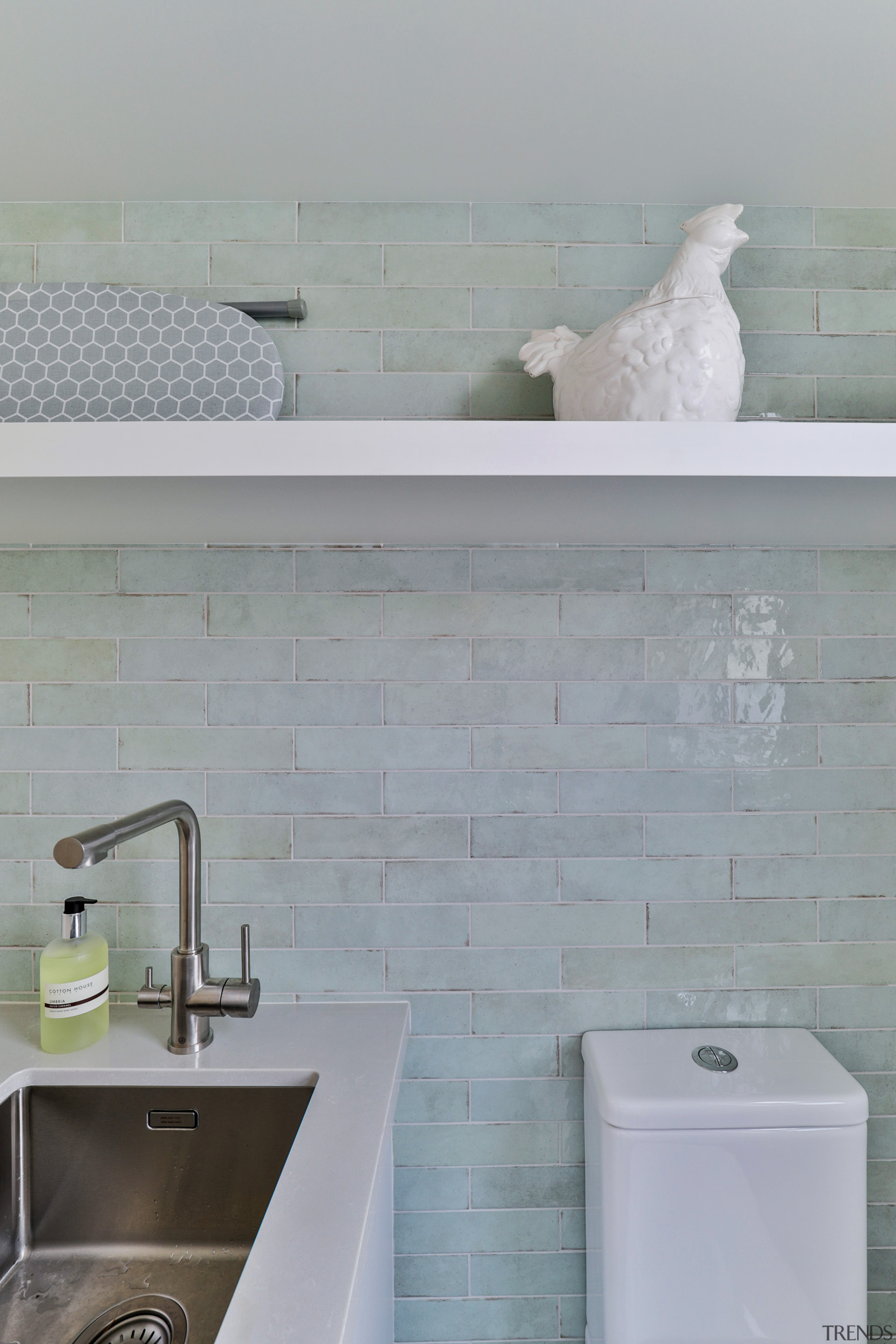 Feature Tribeca Seaglass Mint tiles complete this laundry/mixed 