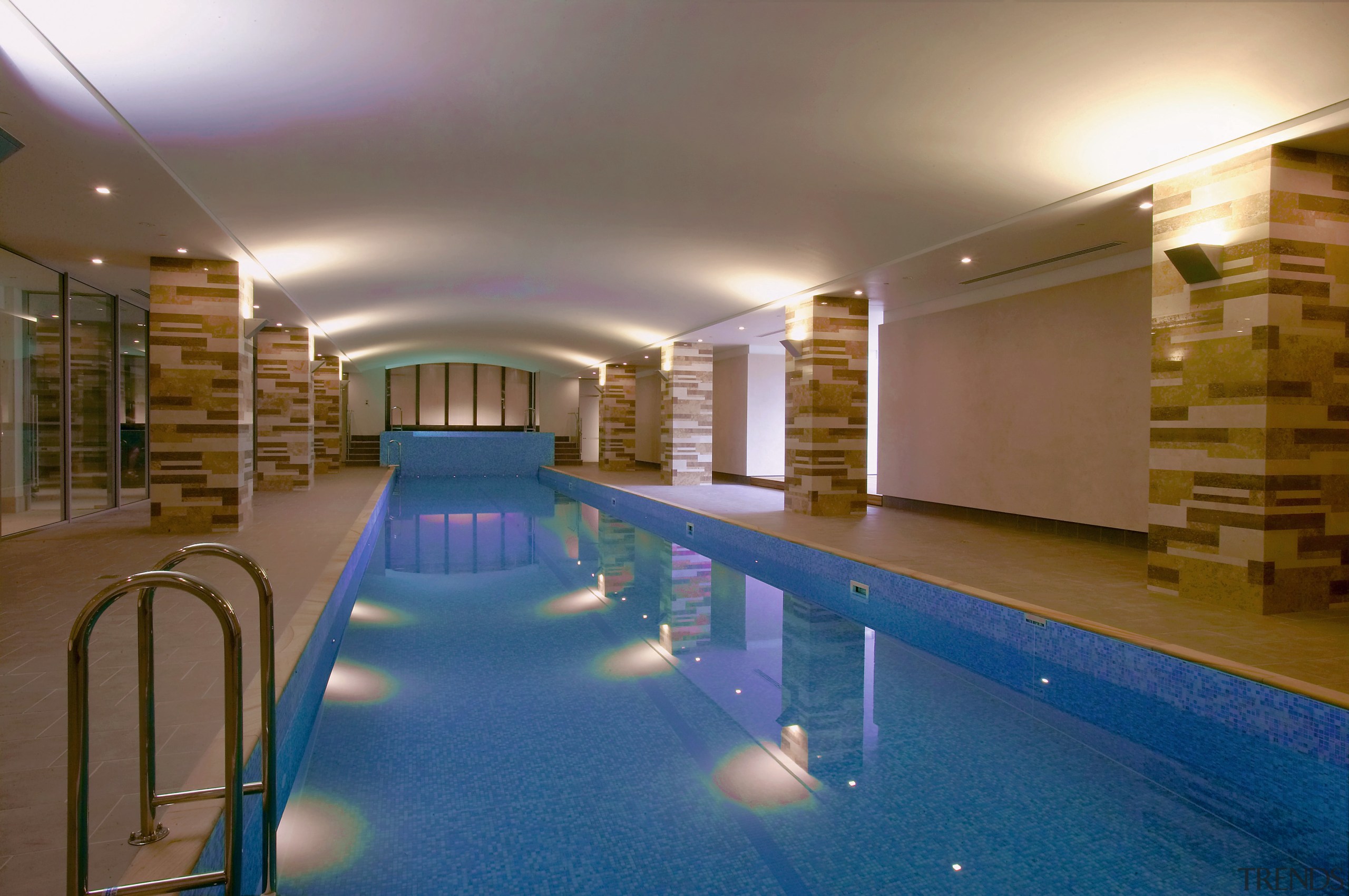 A view of a Far East Consortium apartment apartment, estate, interior design, leisure, leisure centre, lighting, real estate, swimming pool, brown, blue