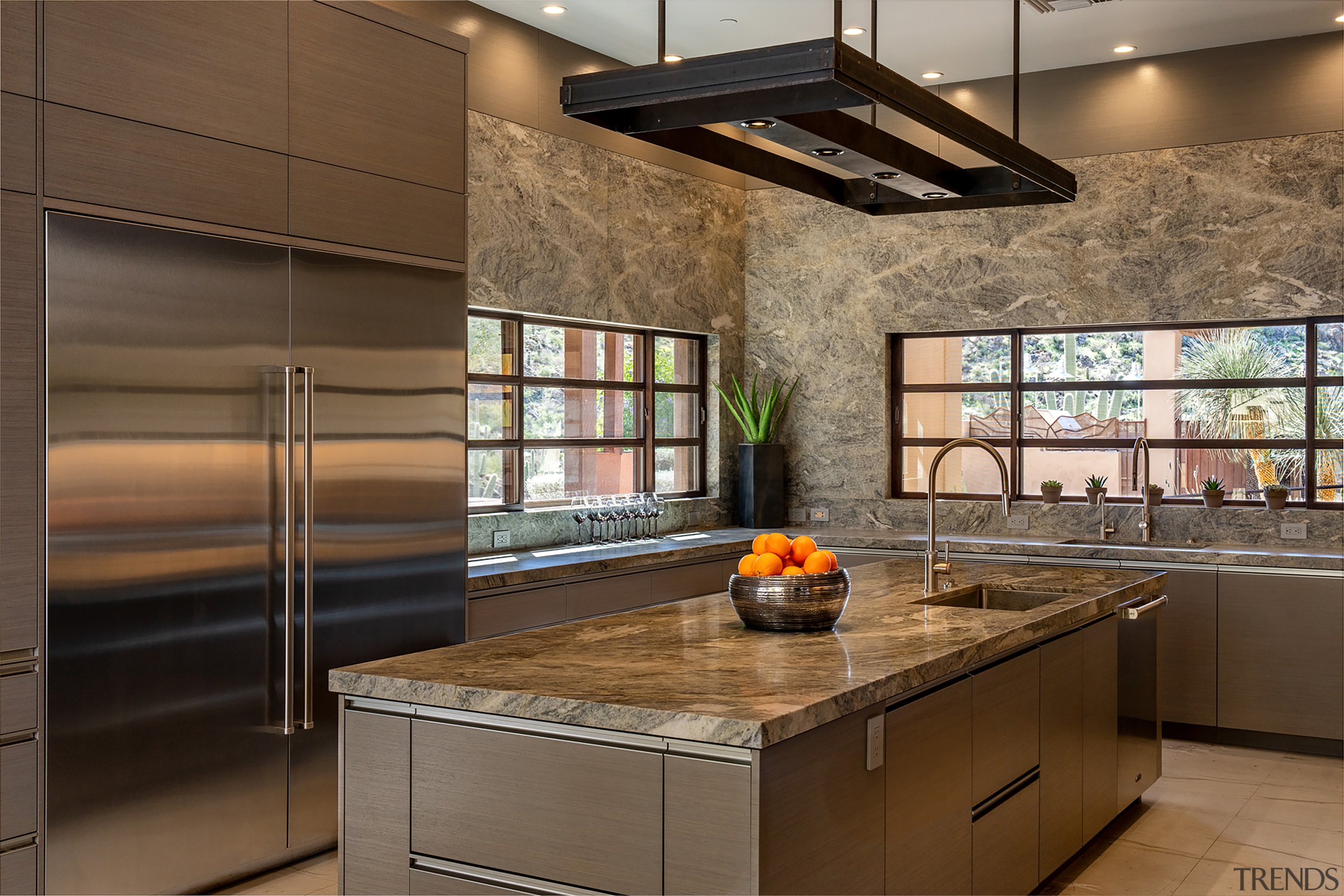 Walnut cabinetry with integrated pulls allows for optimum 