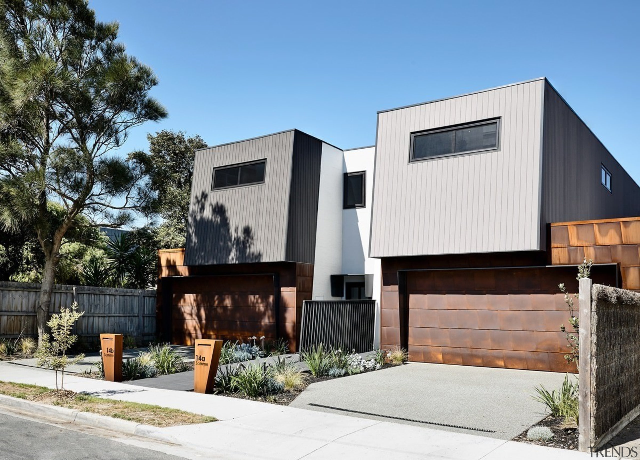 There's just a small fence to separate the architecture, building, facade, home, house, property, real estate, residential area, white