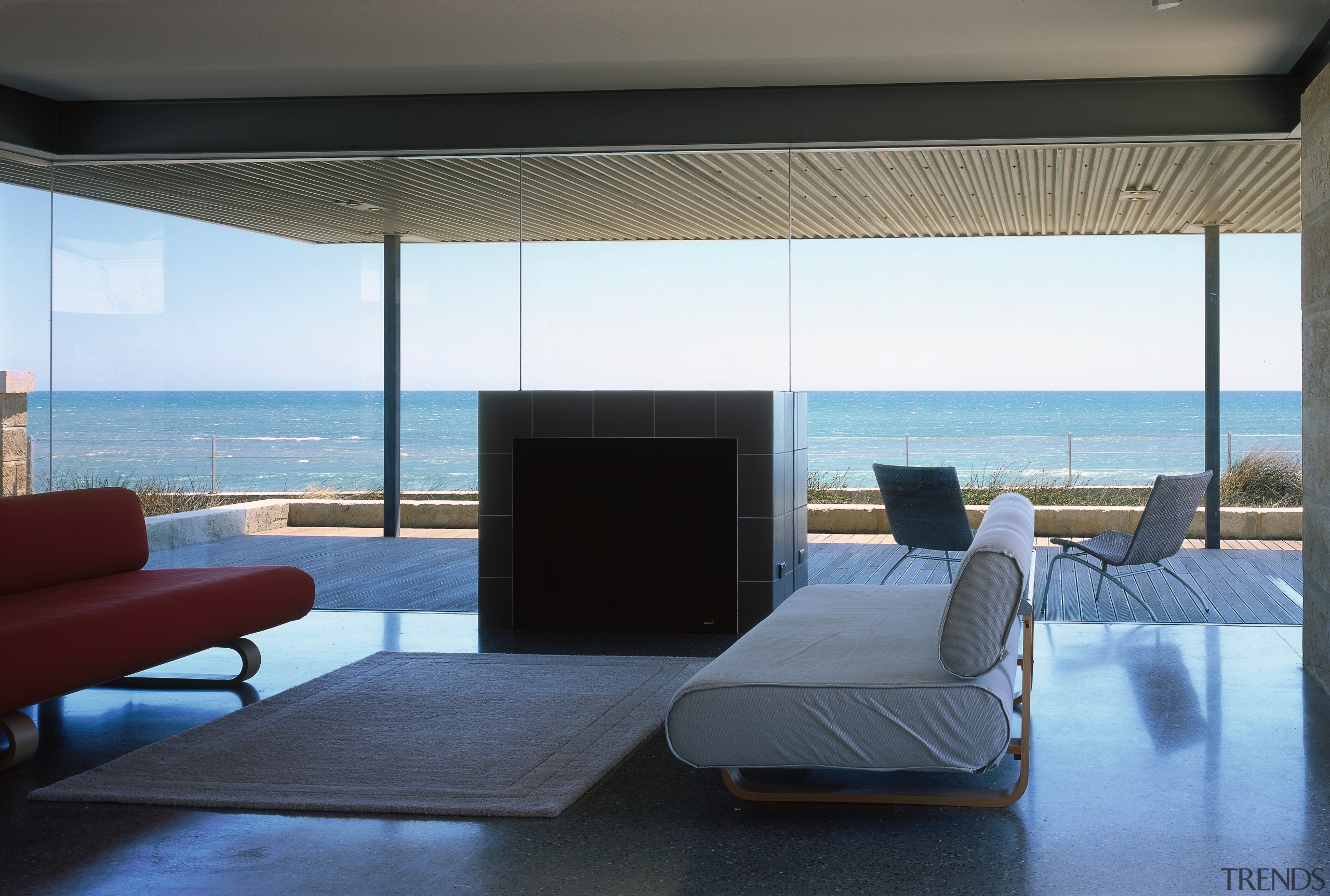 A view of the living area. - A architecture, ceiling, condominium, floor, furniture, house, interior design, living room, property, real estate, table, window, black