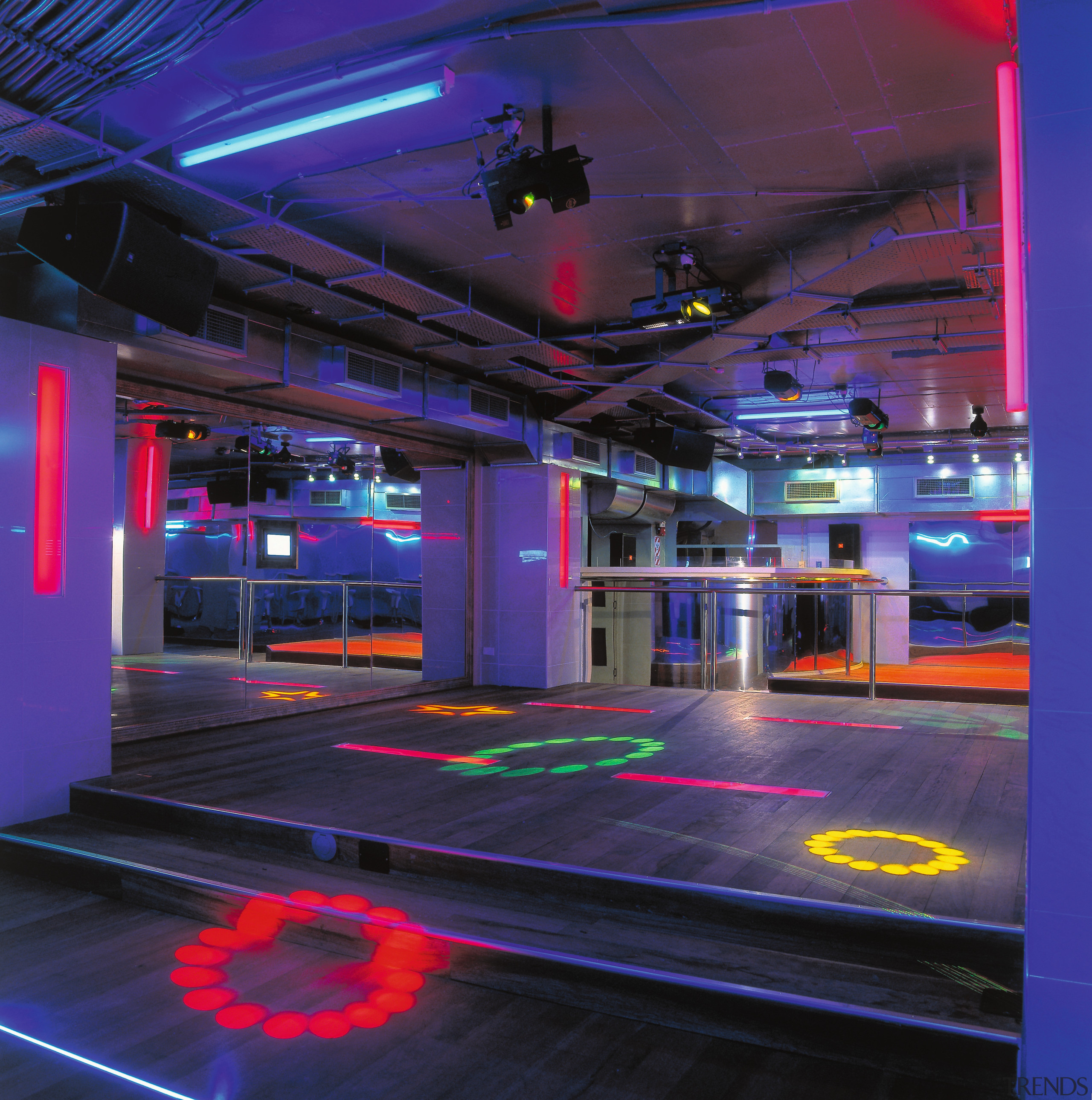 View of bar with raised floor in centre, architecture, light, lighting, metropolitan area, blue