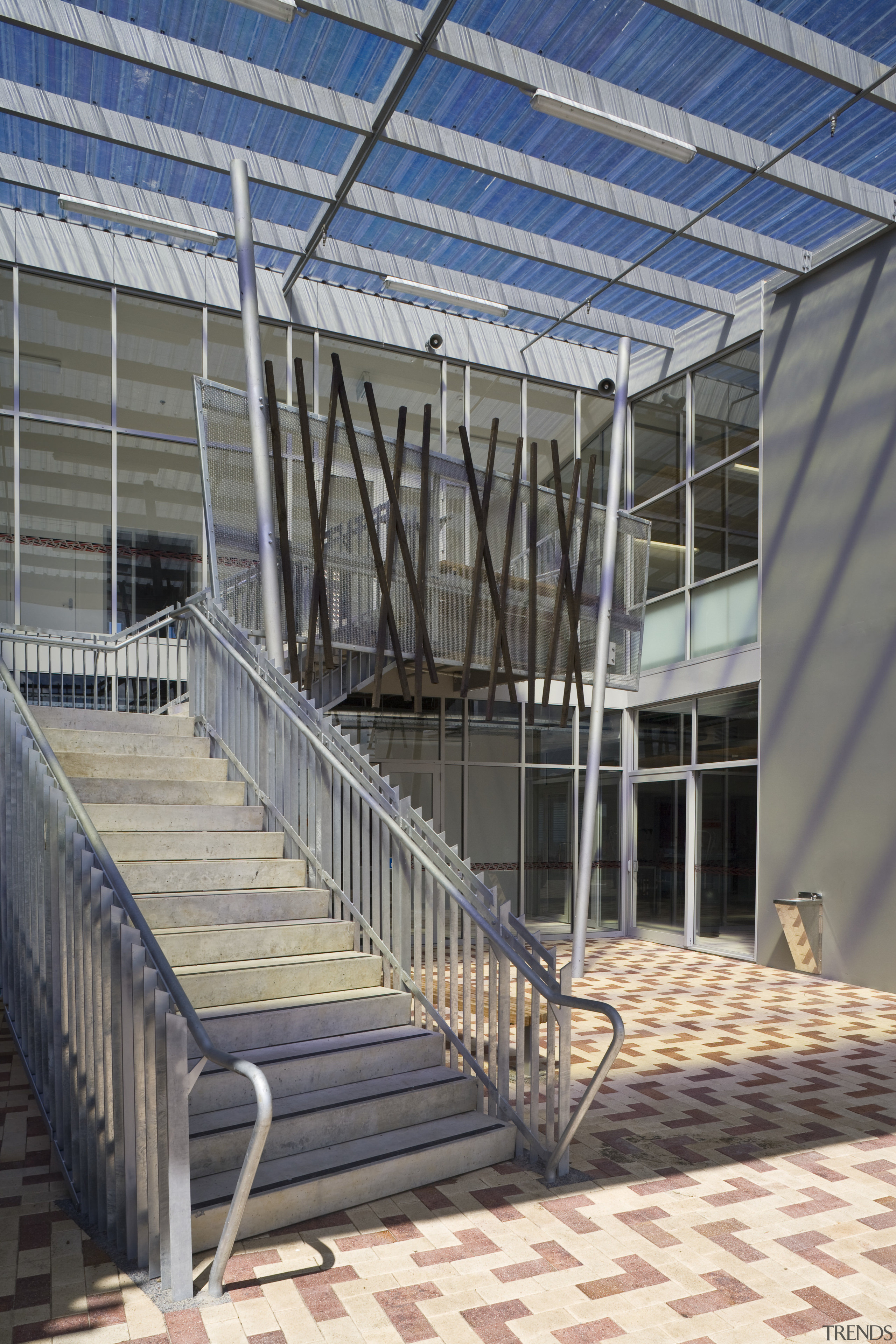 Exterior view of school with stairways which feature architecture, building, daylighting, facade, handrail, real estate, roof, stairs, structure, gray