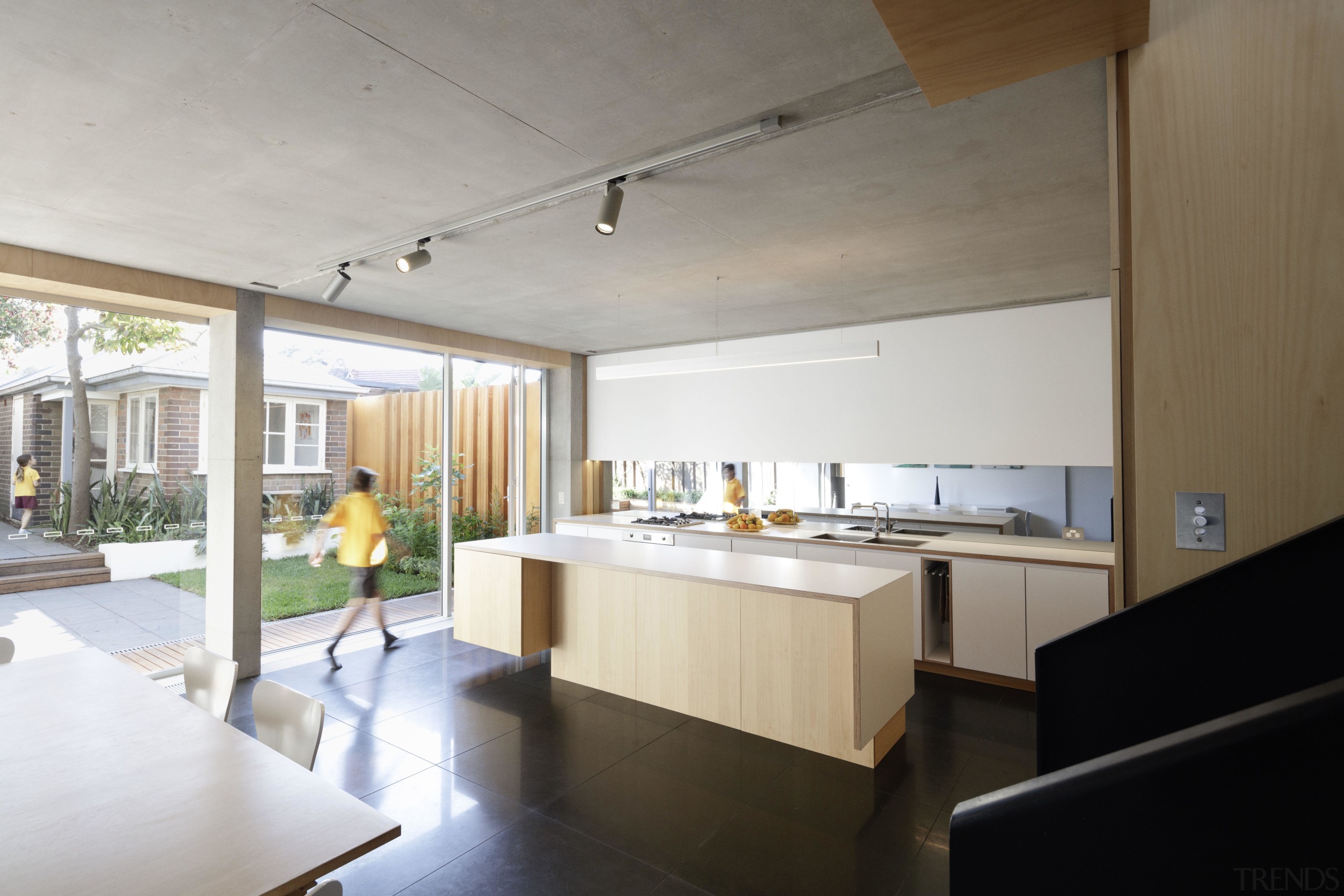 ​​​​​​​This light-filled kitchen by studio203 is built for apartment, architecture, building, ceiling, daylighting, floor, furniture, home, house, interior design, kitchen, loft, property, real estate, room, gray