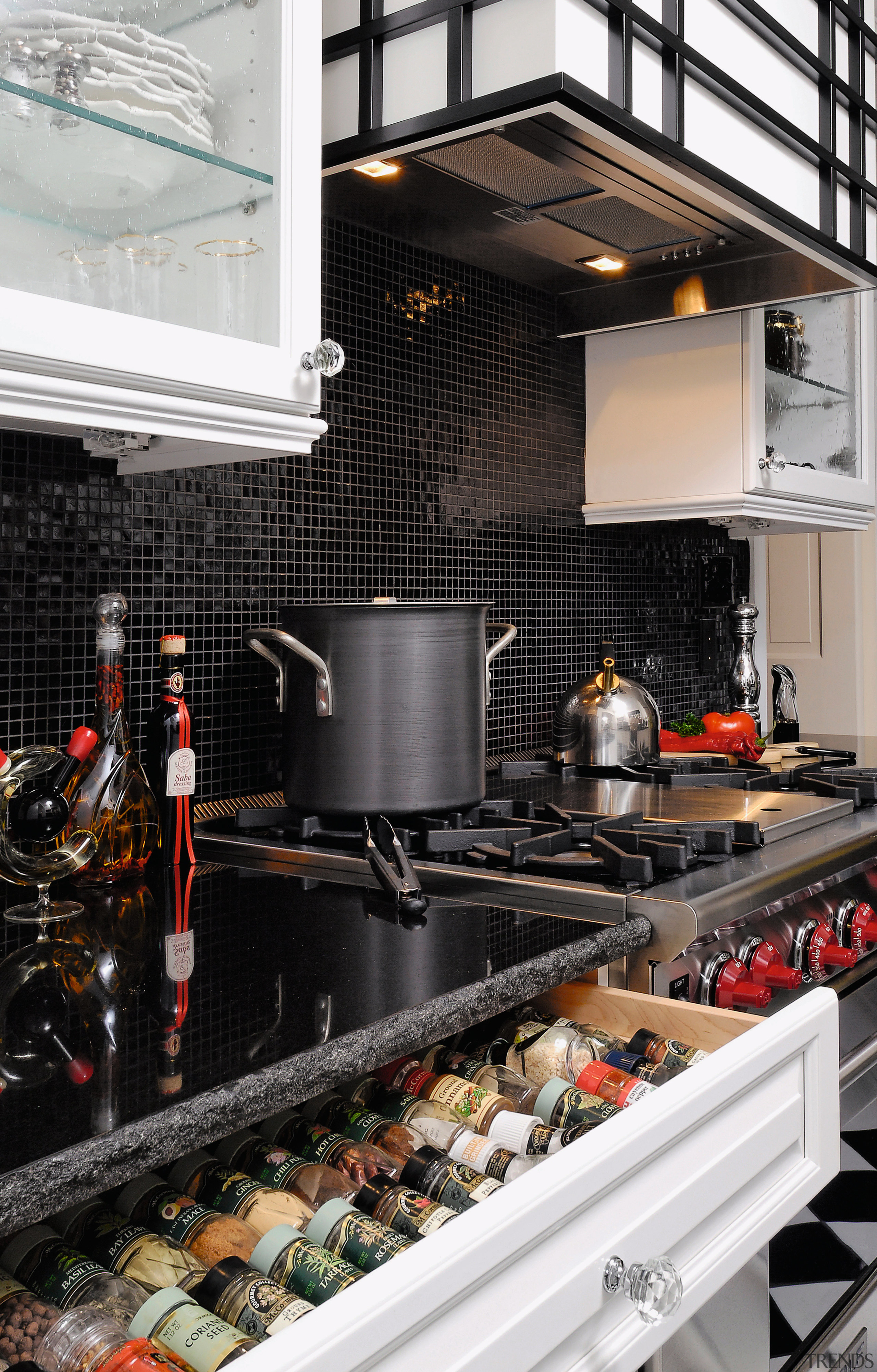 A view of this kitchen featuring black and countertop, interior design, kitchen, black, gray