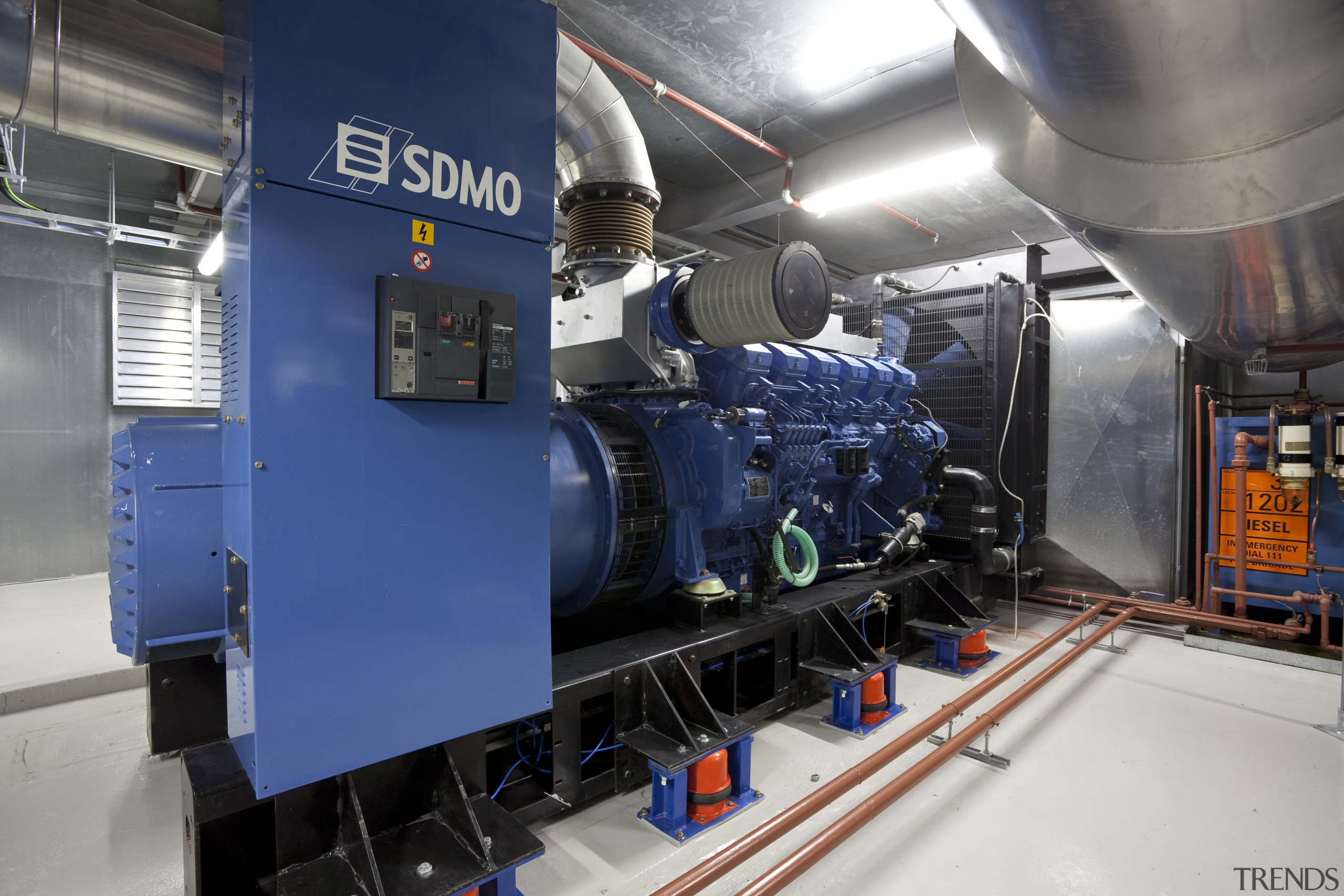 View of Britomart East project, for which Norman engineering, factory, industry, locomotive, machine, manufacturing, public transport, railroad car, rapid transit, rolling stock, transport, blue