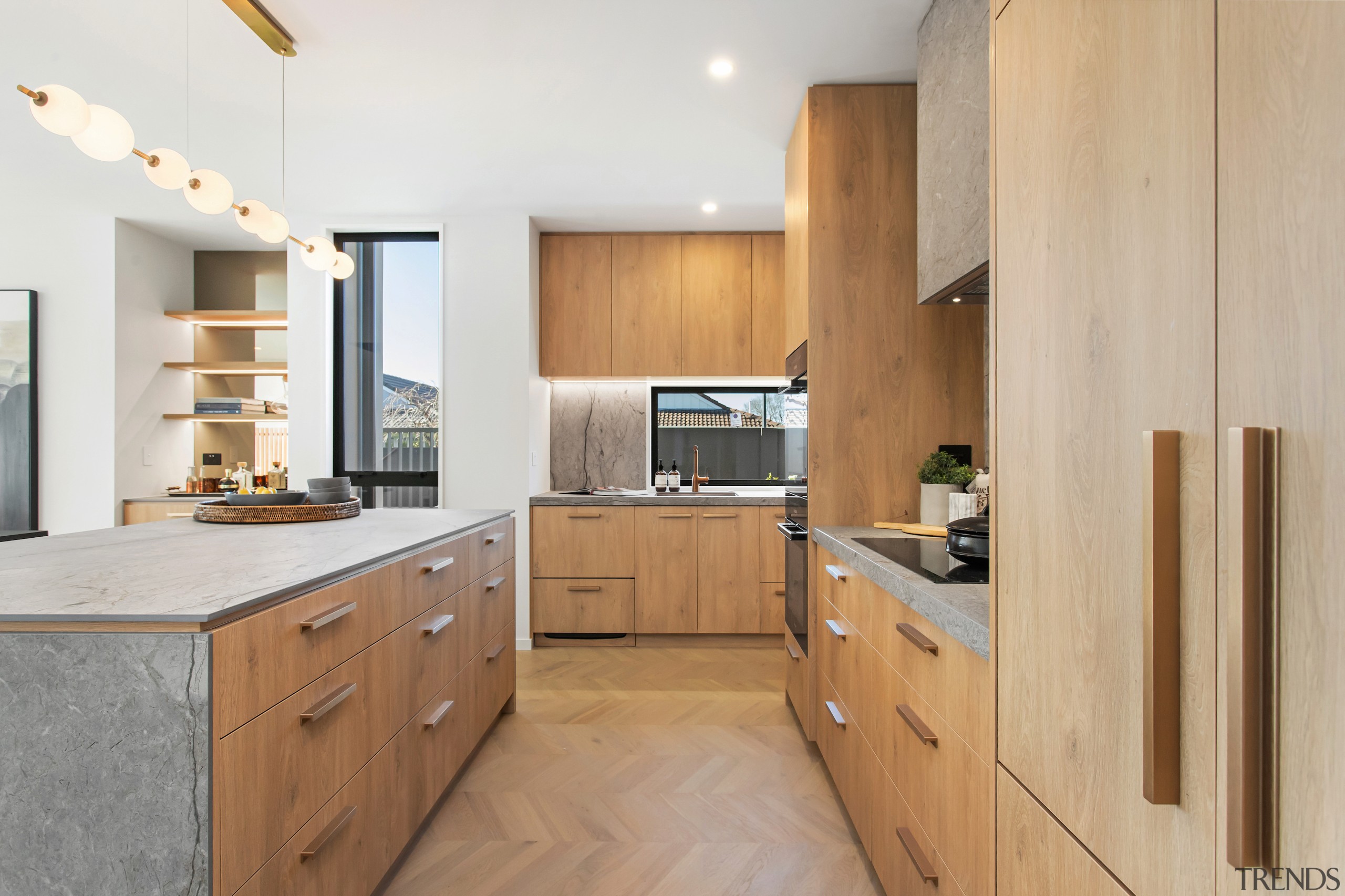 The kitchen reflects a warm wood appeal. - 