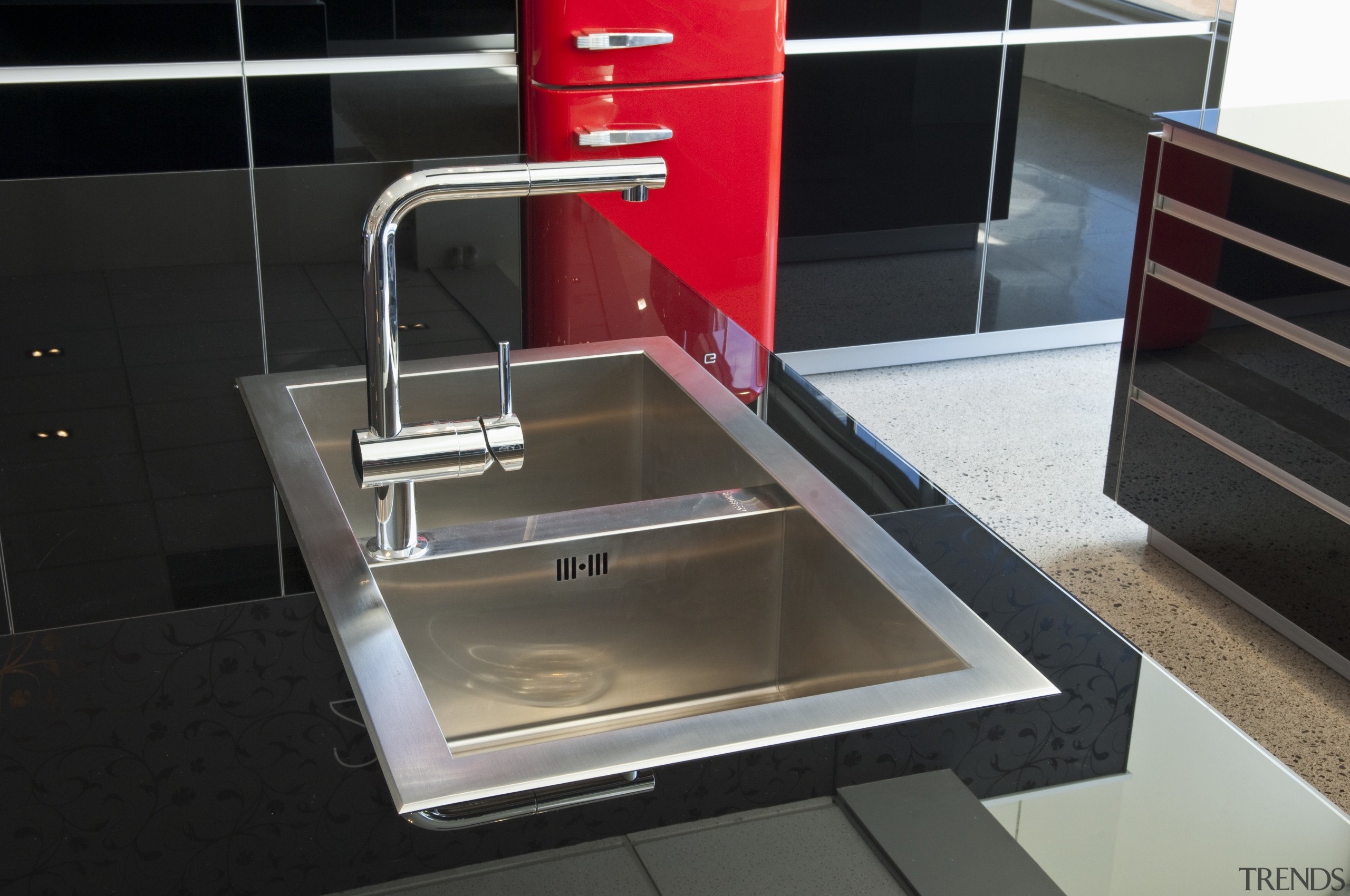 View of kitchen which features stainless steel Smeg countertop, kitchen, plumbing fixture, product design, sink, black
