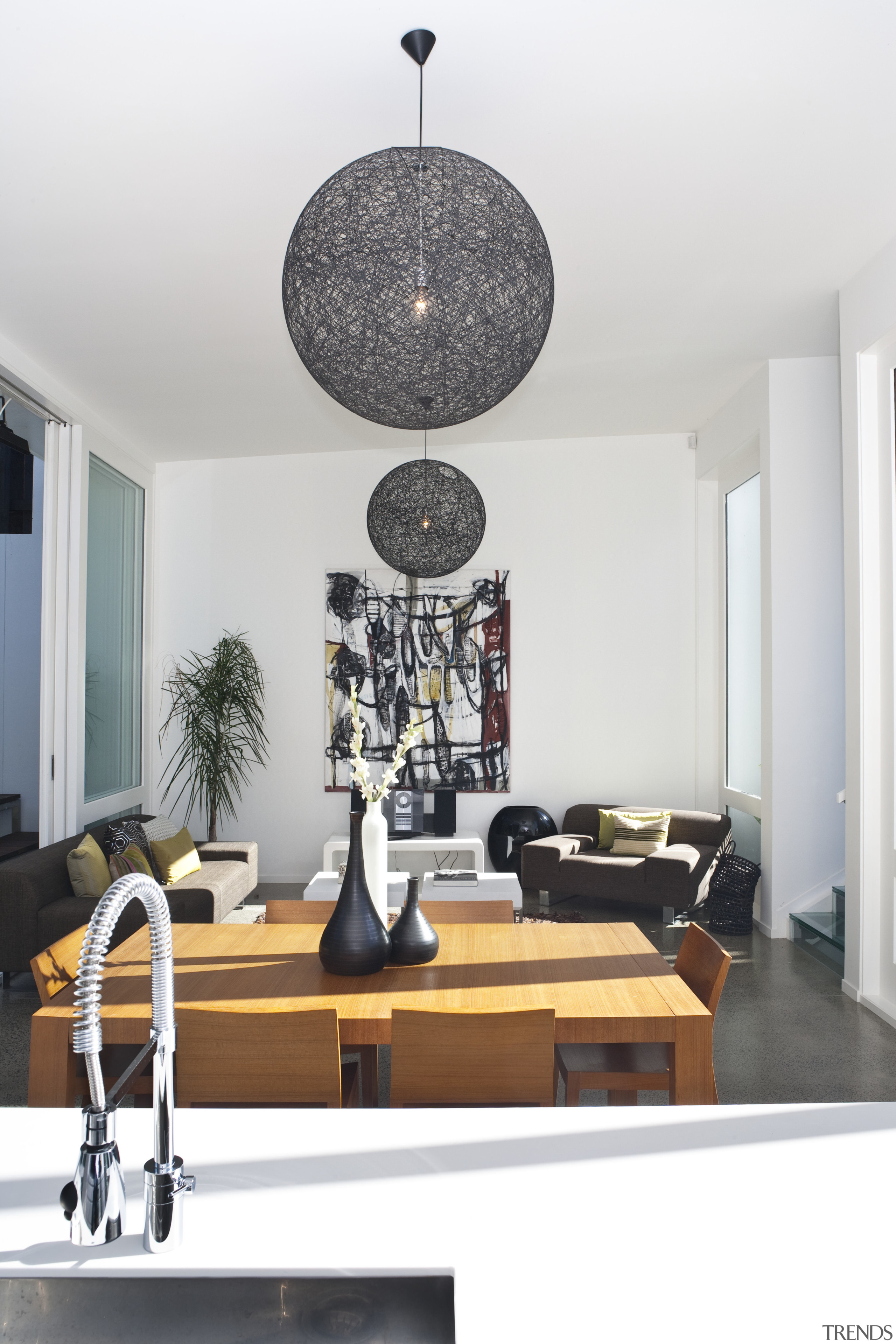 View of this modern home - View of ceiling, furniture, home, interior design, light fixture, lighting, living room, product design, table, white