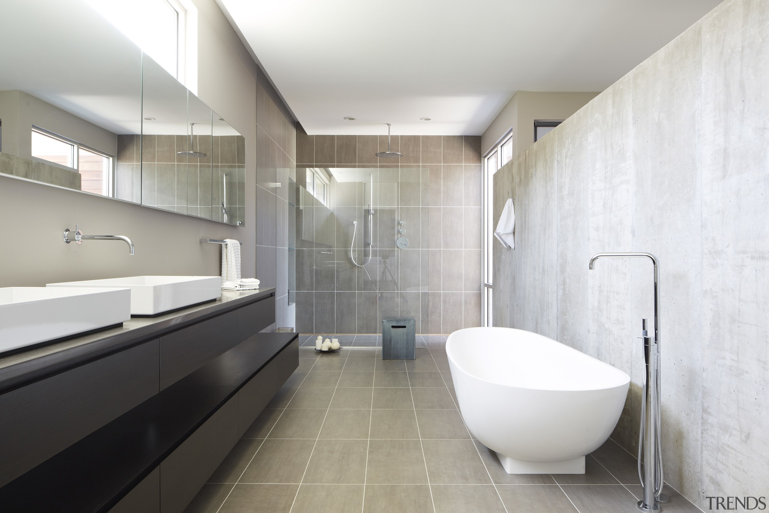 The handleless wenge vanity in this bathroom consists architecture, bathroom, floor, interior design, room, tile, gray, white