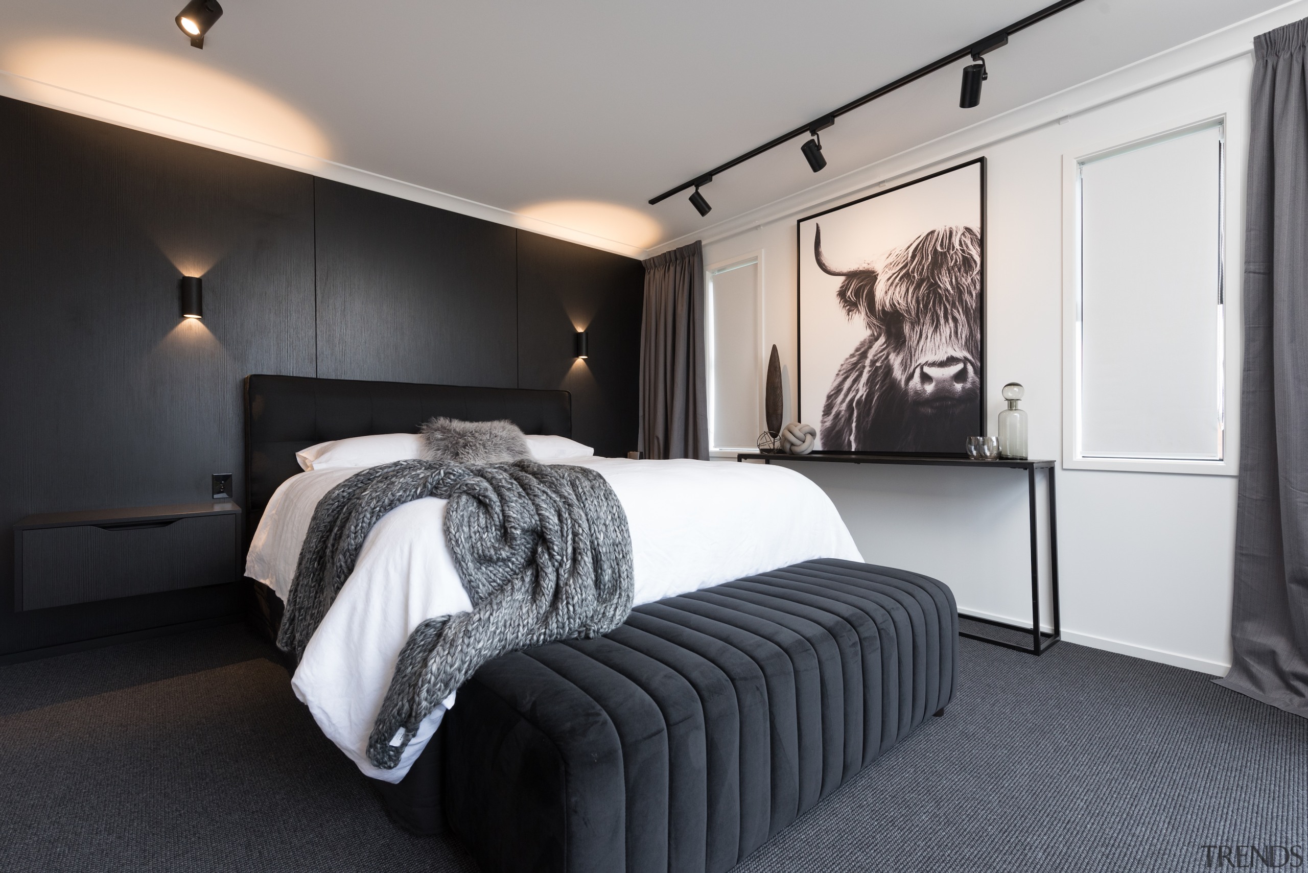 The master bedroom's black feature wall is highlighted 