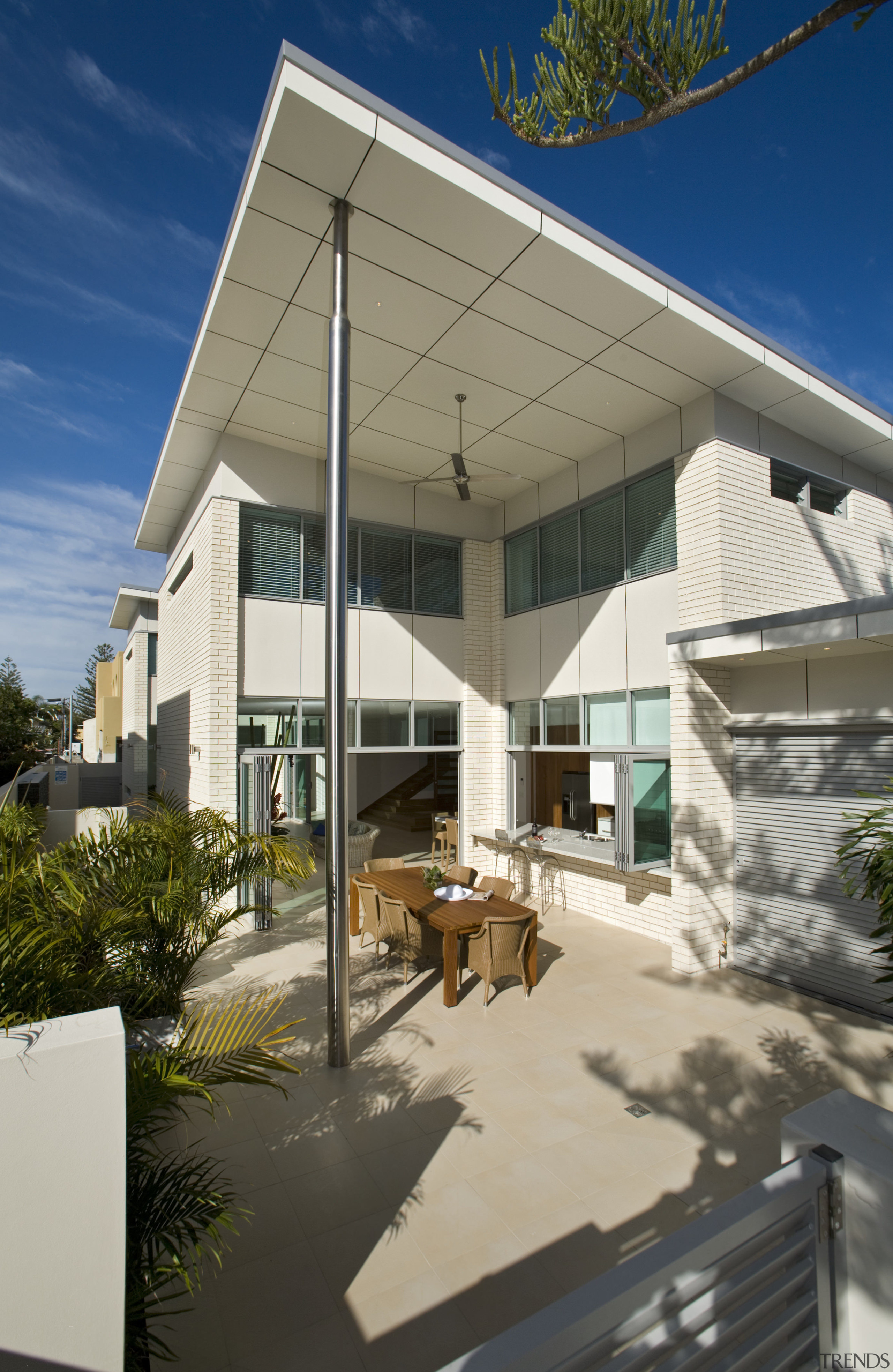 View of open-plan brick house with stainless steel architecture, daylighting, facade, home, house, real estate, roof, shade, gray