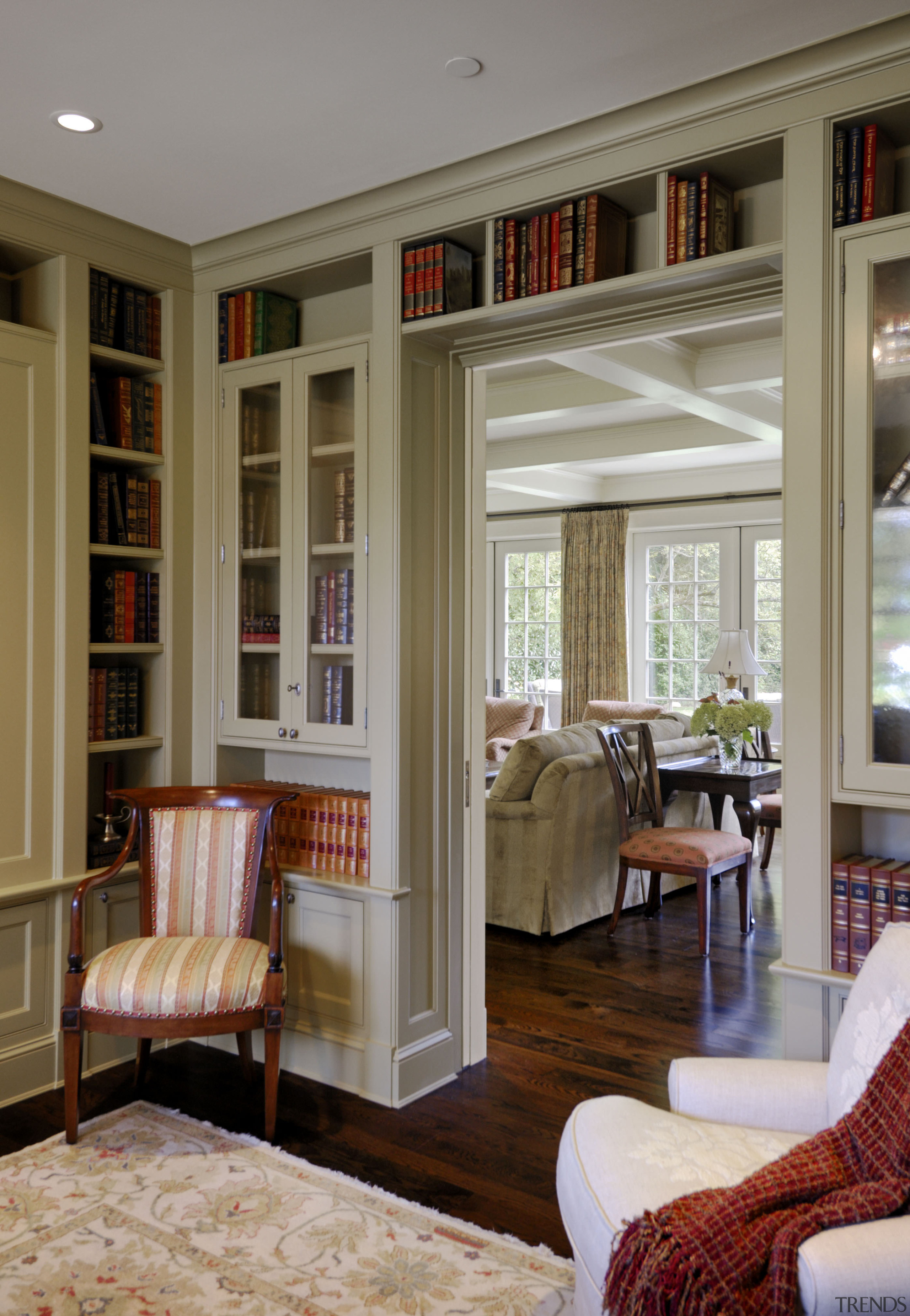 Image of Library featuring single seat sofa chairs. ceiling, door, floor, flooring, furniture, home, interior design, living room, room, wall, window, window covering, window treatment, gray, brown
