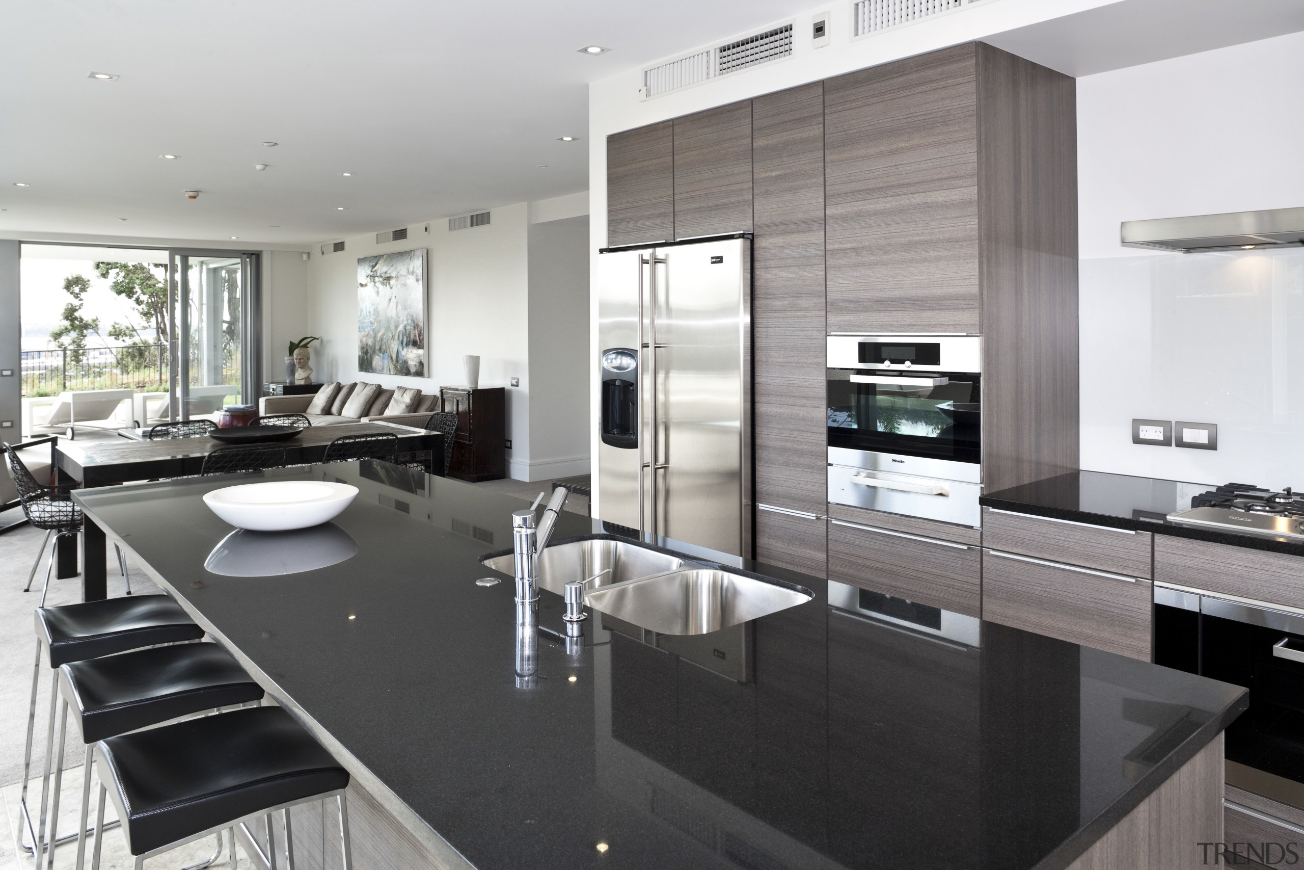 View of the open plan living area featuring countertop, interior design, kitchen, white, black, gray