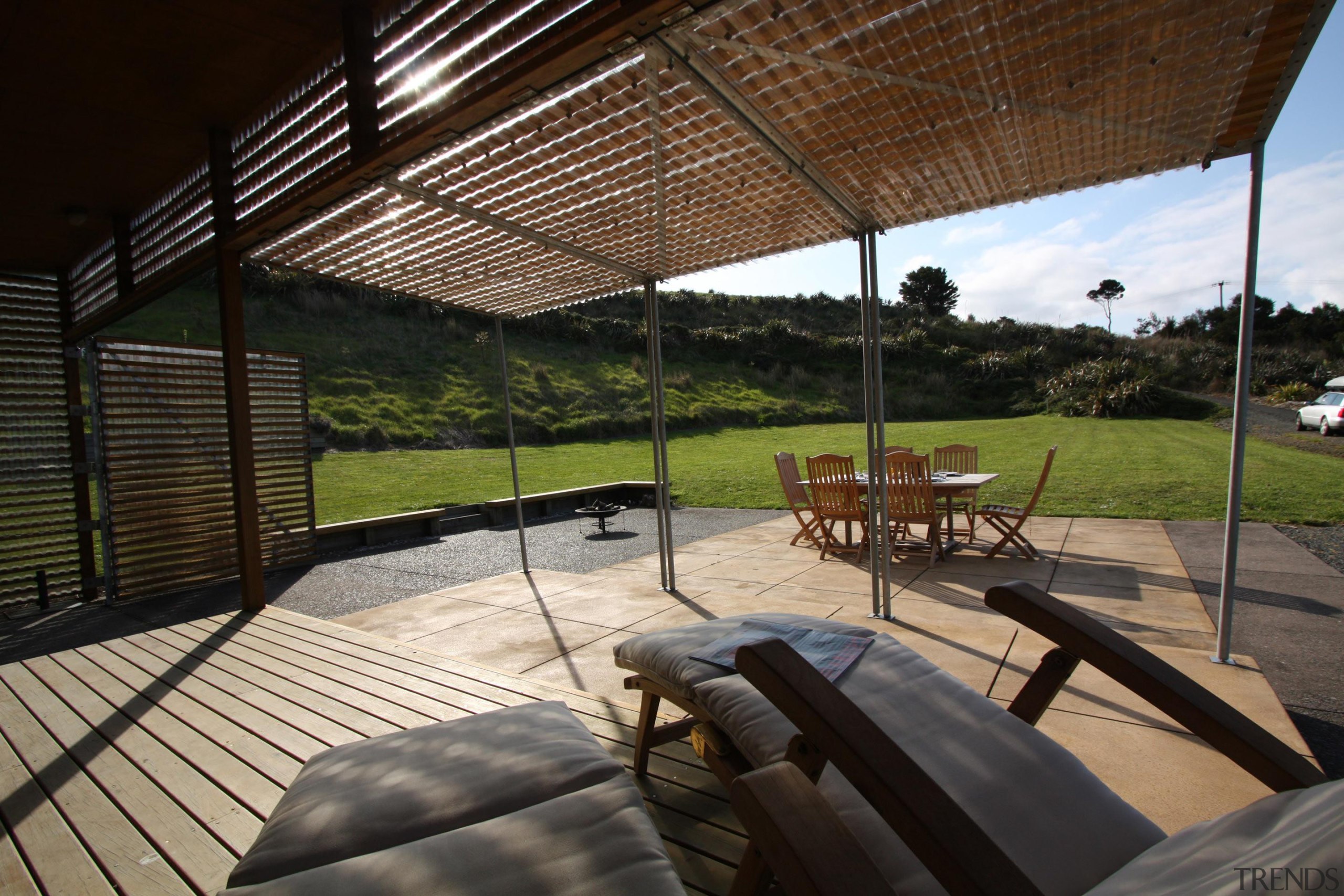 View from the loungers across the terrace to architecture, house, outdoor structure, property, real estate, shade, black
