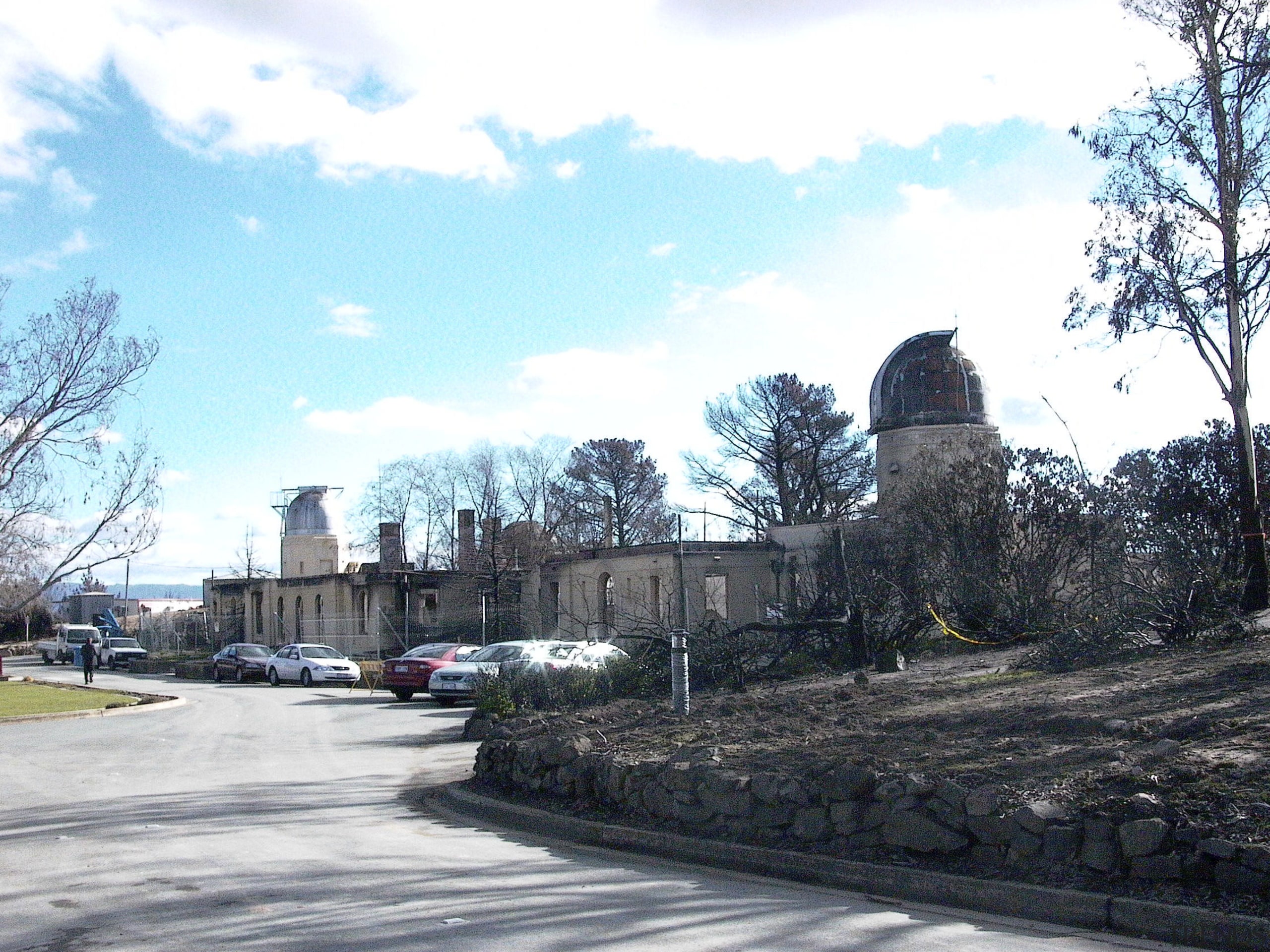 View of the observatory prior to renovations after building, cloud, home, house, neighbourhood, residential area, road, sky, suburb, town, tree, white