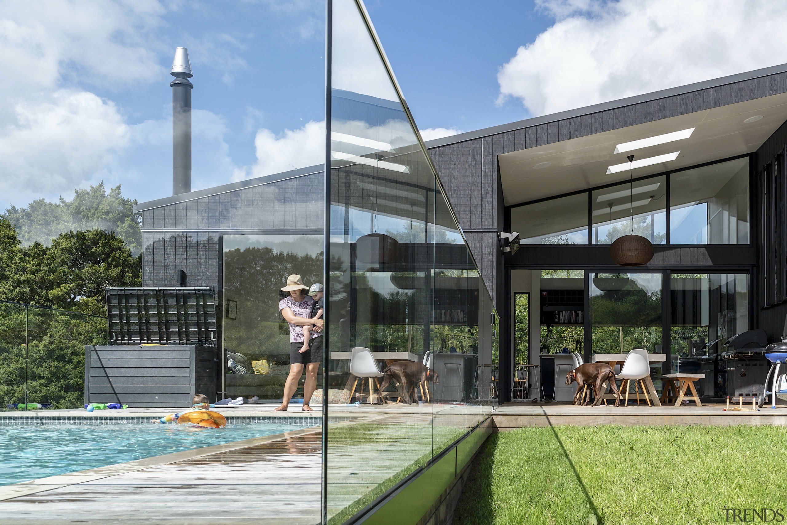 The home's soaring, wall of glass living spaces 