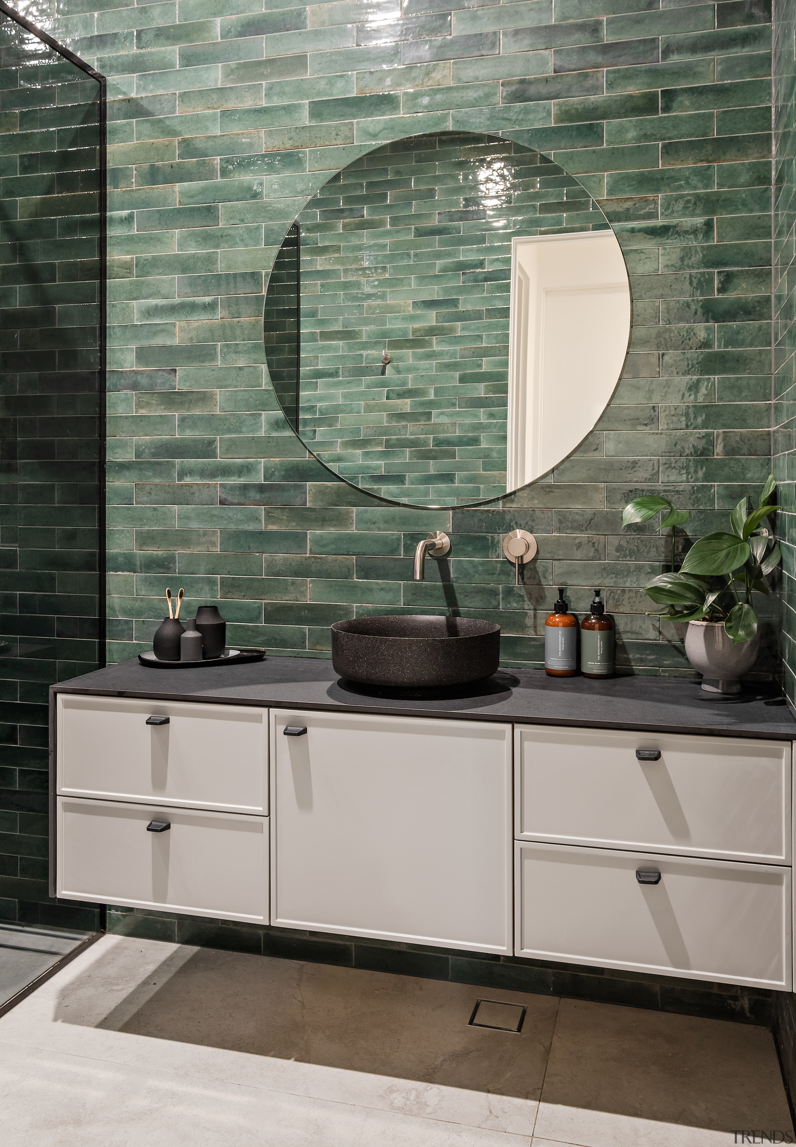 A cantilevered vanity adds to the bathroom's sense 