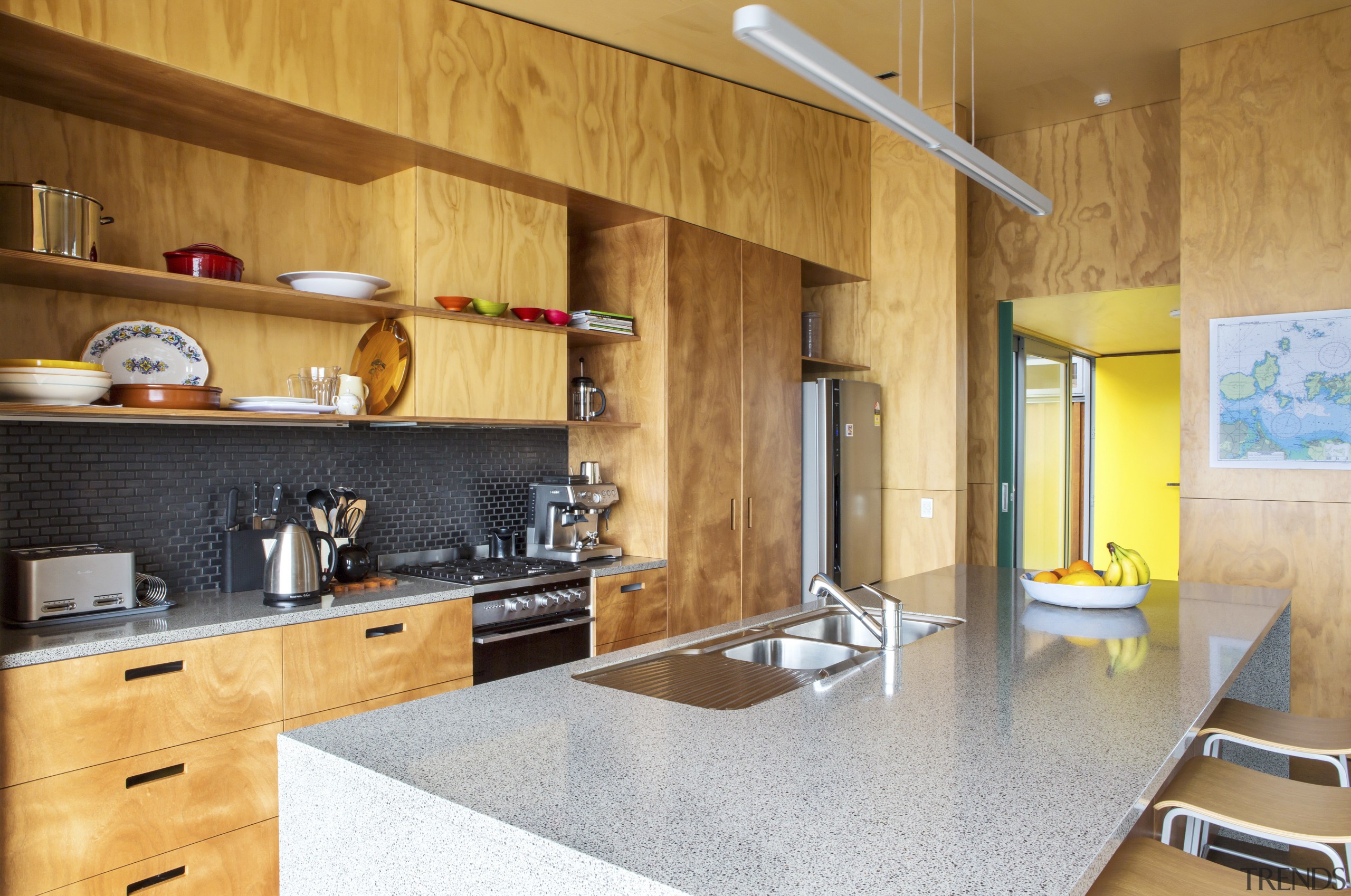 This new holiday home, designed and built by cabinetry, countertop, cuisine classique, floor, flooring, interior design, kitchen, real estate, room, wall, orange