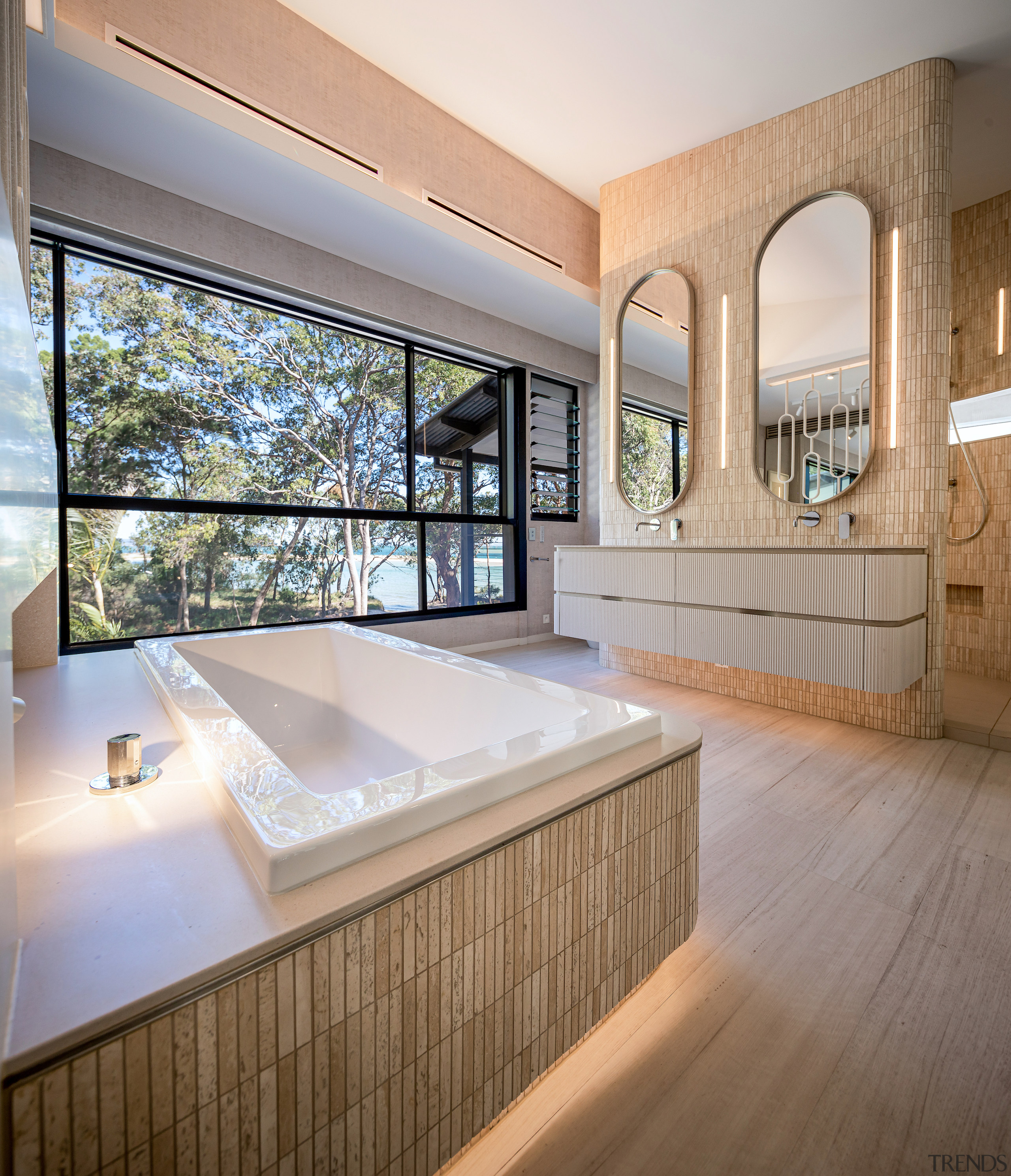 The bath is housed within a Corian platform 