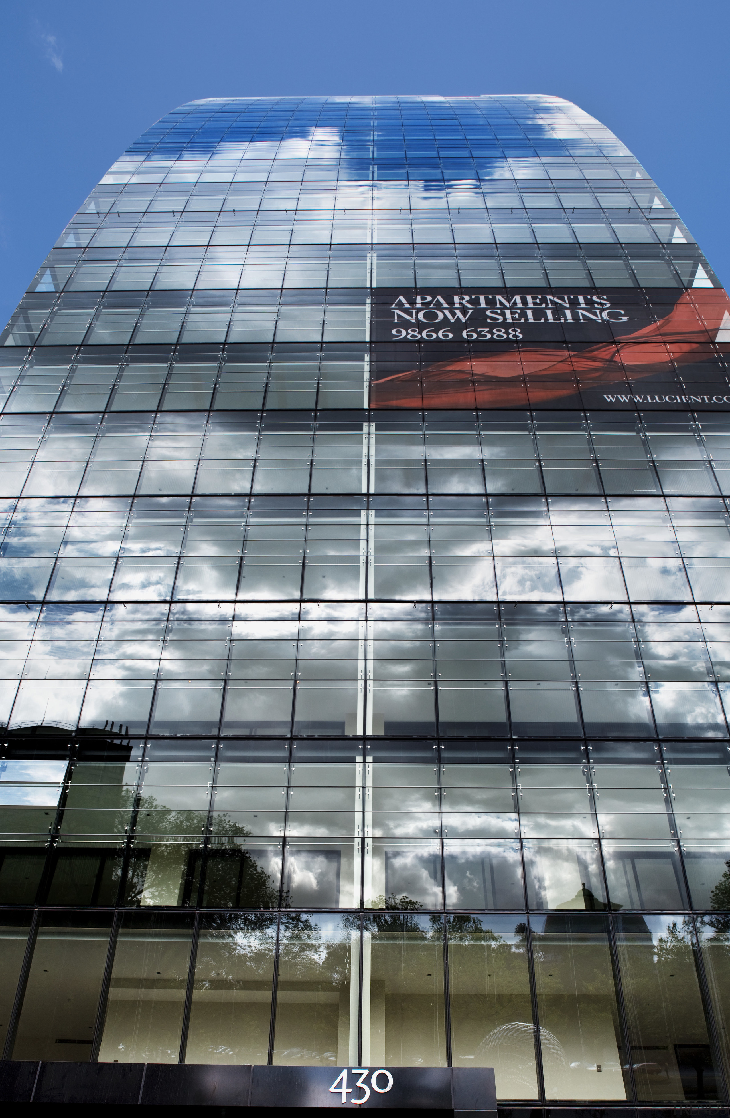 Exterior view of the Lucient apartments in Melbourne architecture, building, city, commercial building, condominium, corporate headquarters, daylighting, daytime, facade, headquarters, landmark, metropolis, metropolitan area, reflection, sky, skyscraper, tower, tower block, urban area, gray
