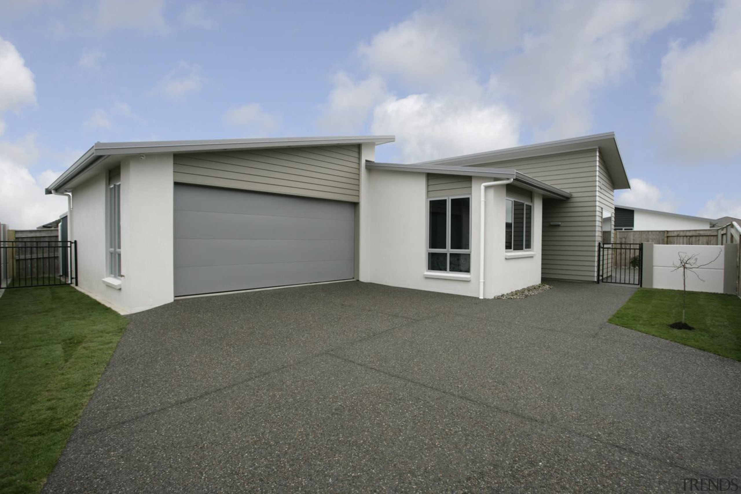 Award winning 'Bridget' town house in plaster and asphalt, building, elevation, estate, facade, garage, home, house, property, real estate, residential area, siding, gray