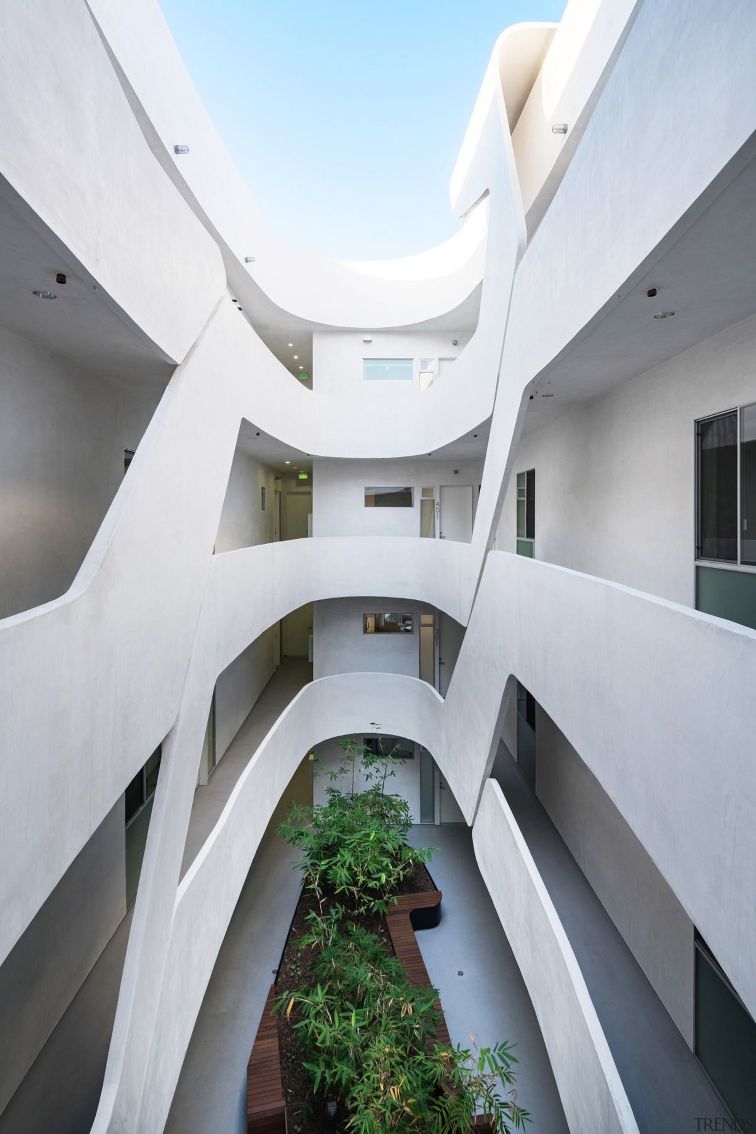 This courtyard area is a like a set apartment, architecture, building, condominium, daylighting, facade, headquarters, house, real estate, stairs, white