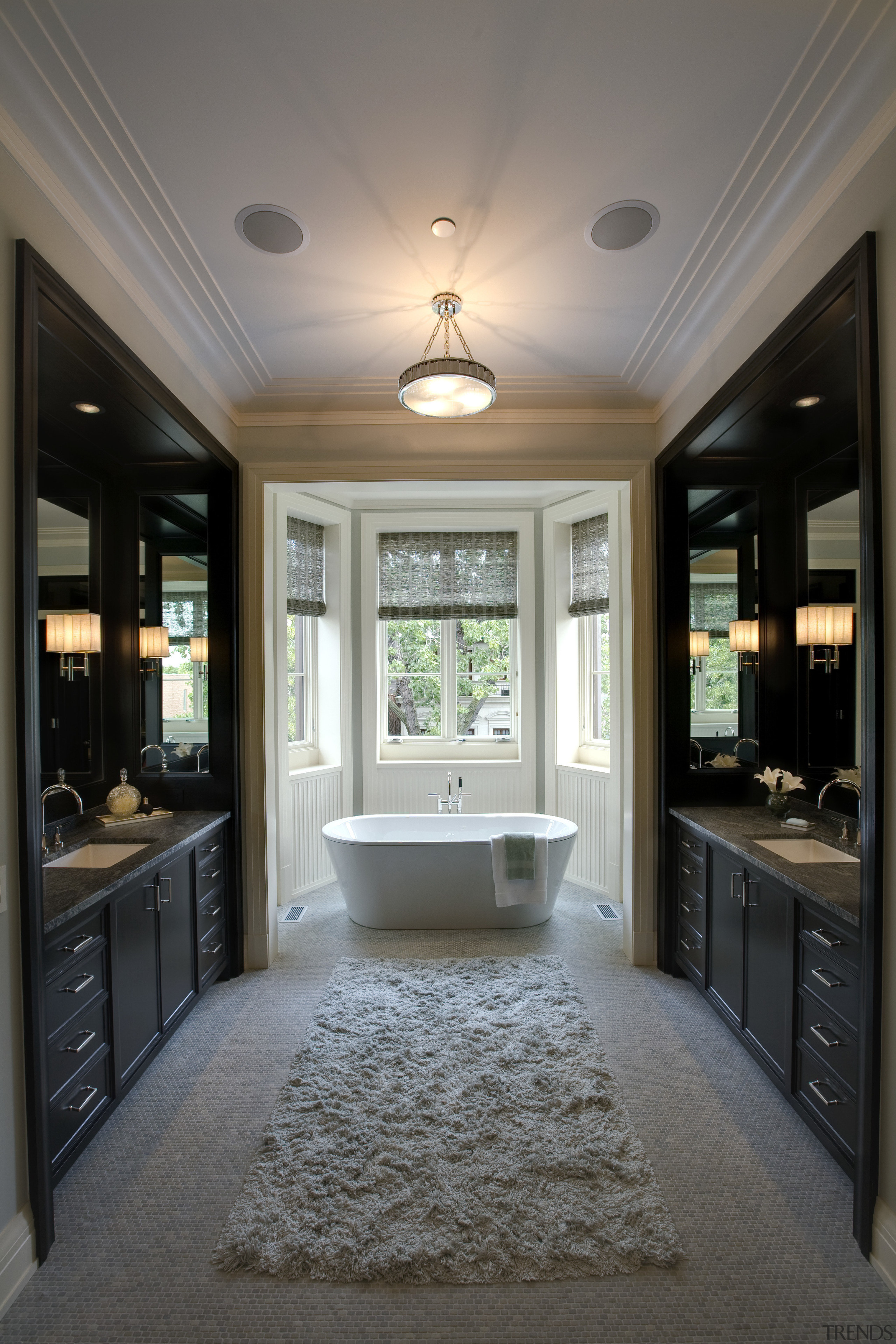 The free standing tub is the focal point bathroom, cabinetry, ceiling, countertop, estate, floor, flooring, home, interior design, kitchen, room, window, gray, black