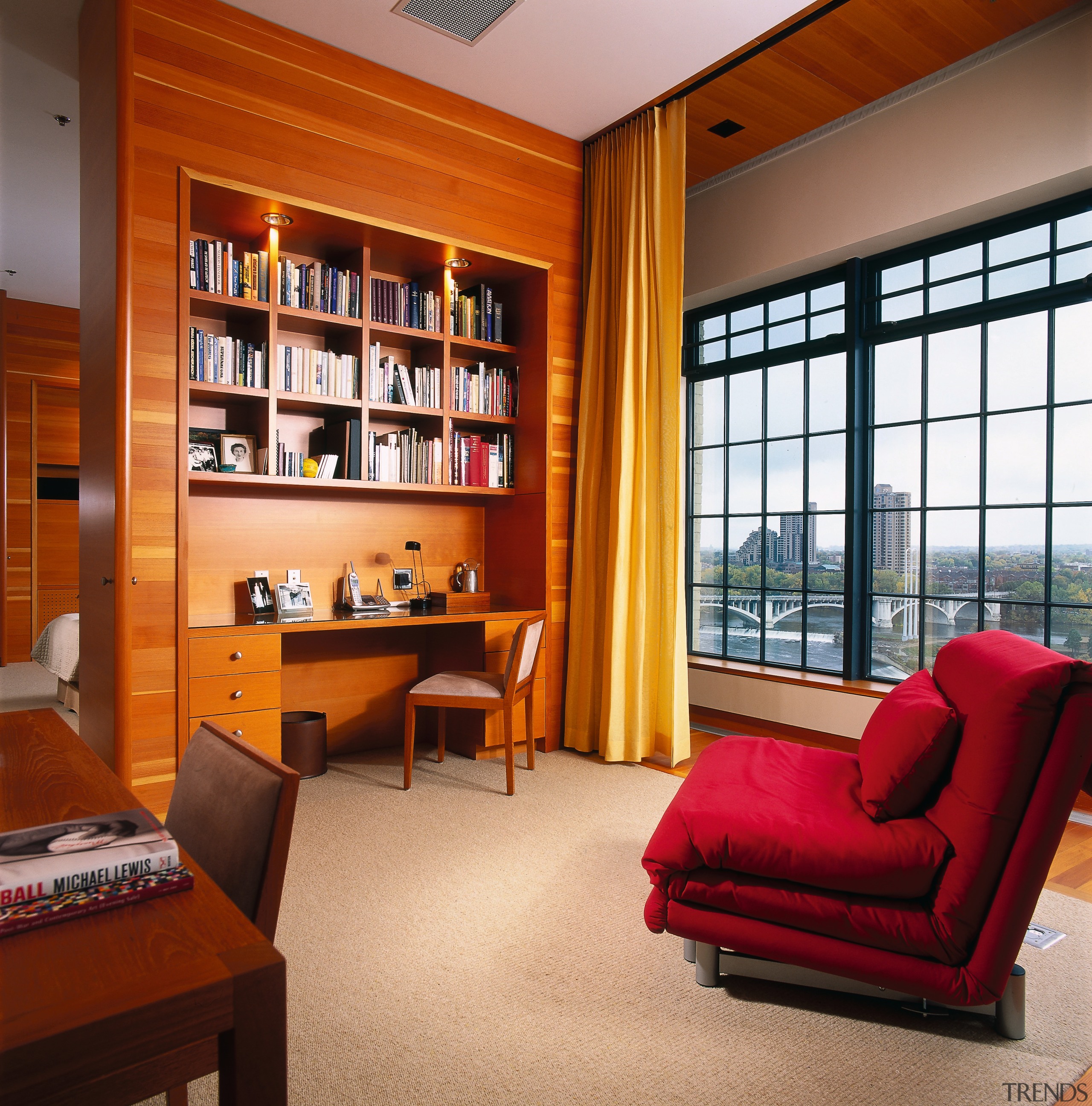 View of a study area, carpet, wooden wall bookcase, ceiling, furniture, interior design, living room, real estate, room, shelving, brown