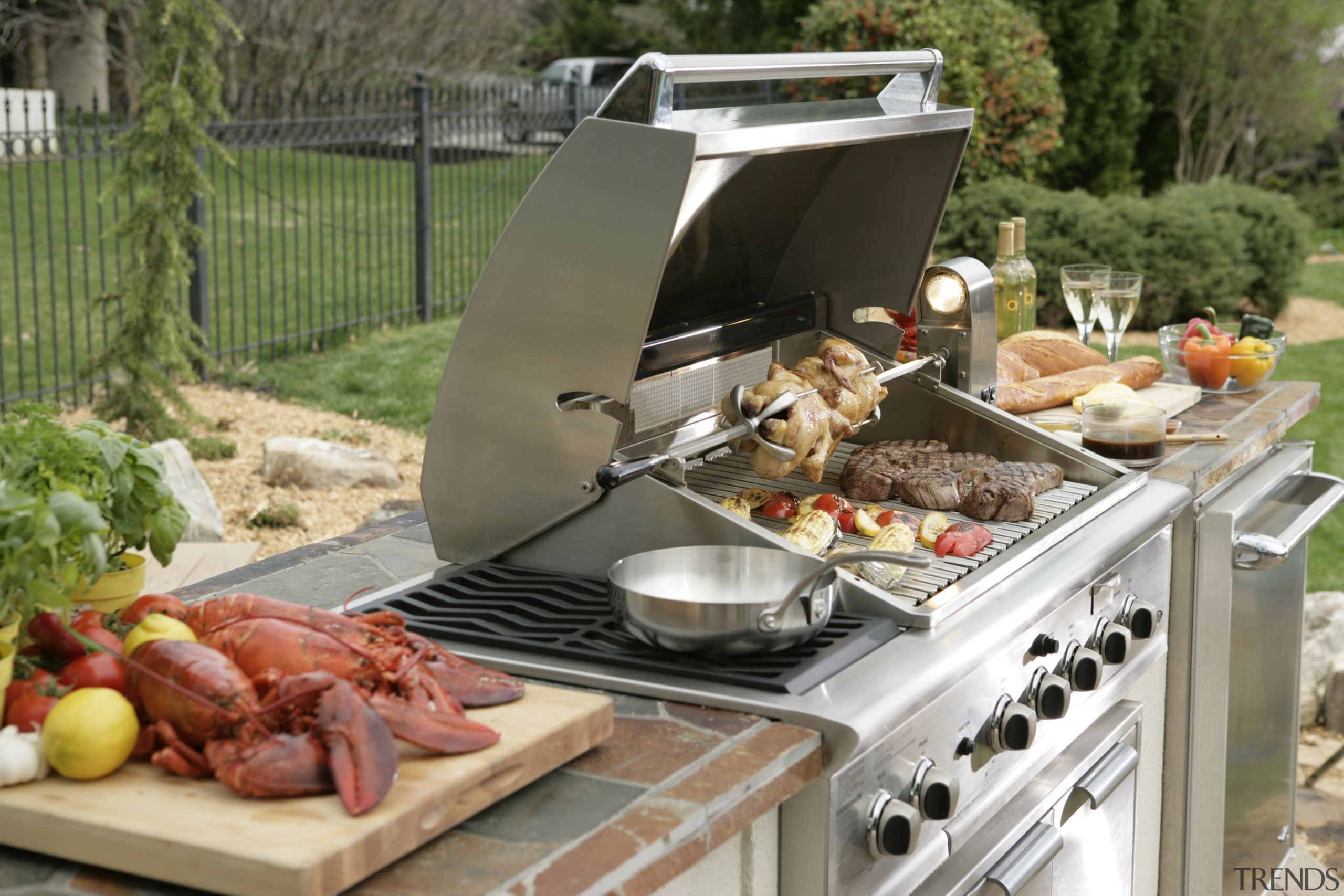 View of DCS outdoor cooking equipment by Fisher animal source foods, barbecue, barbecue grill, brunch, buffet, cuisine, dish, food, grilling, kitchen appliance, meal, meat, outdoor grill, brown