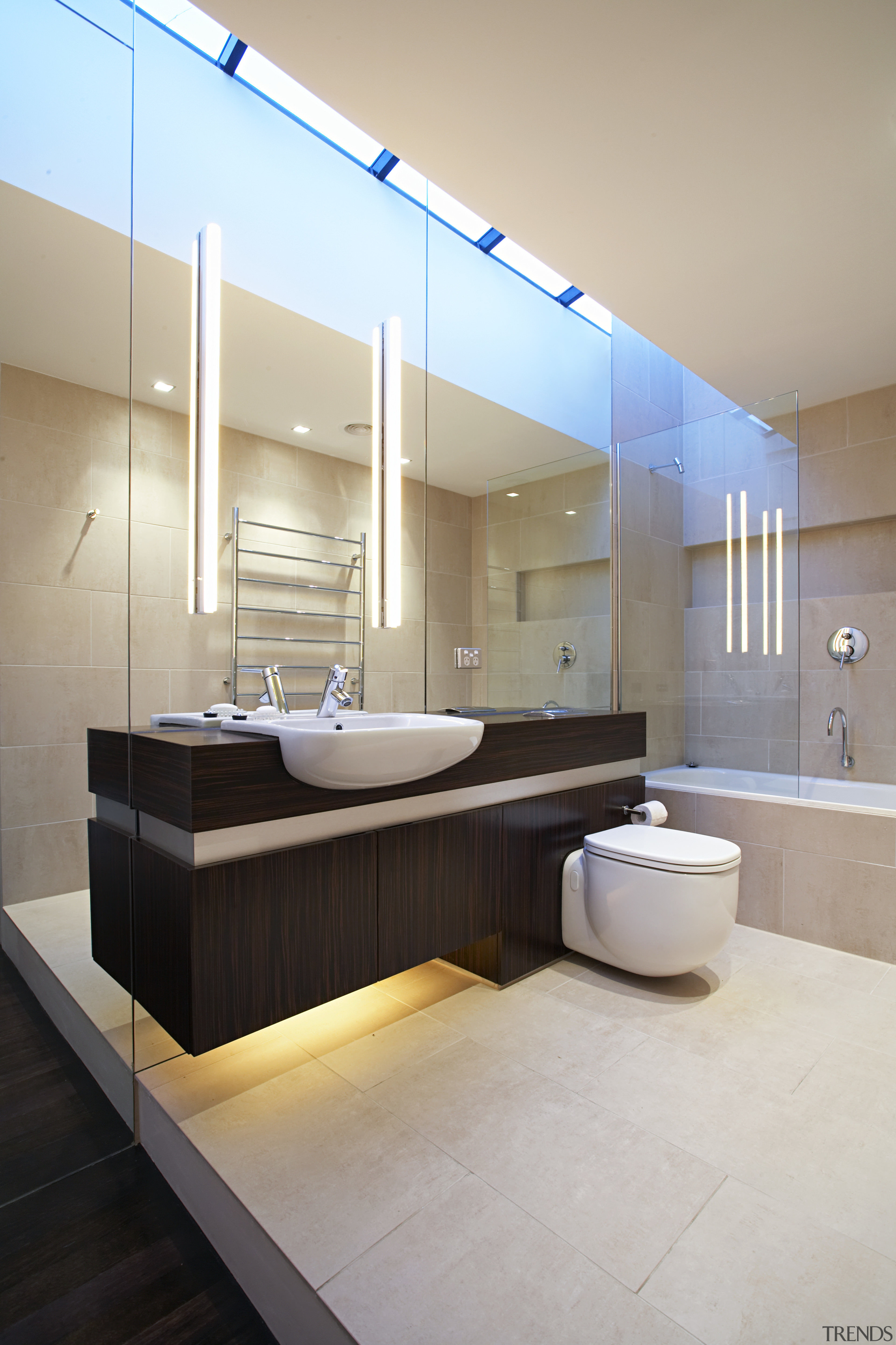 In the bathroom are the laundry, a vanity, architecture, bathroom, ceiling, floor, home, interior design, product design, room, sink, gray